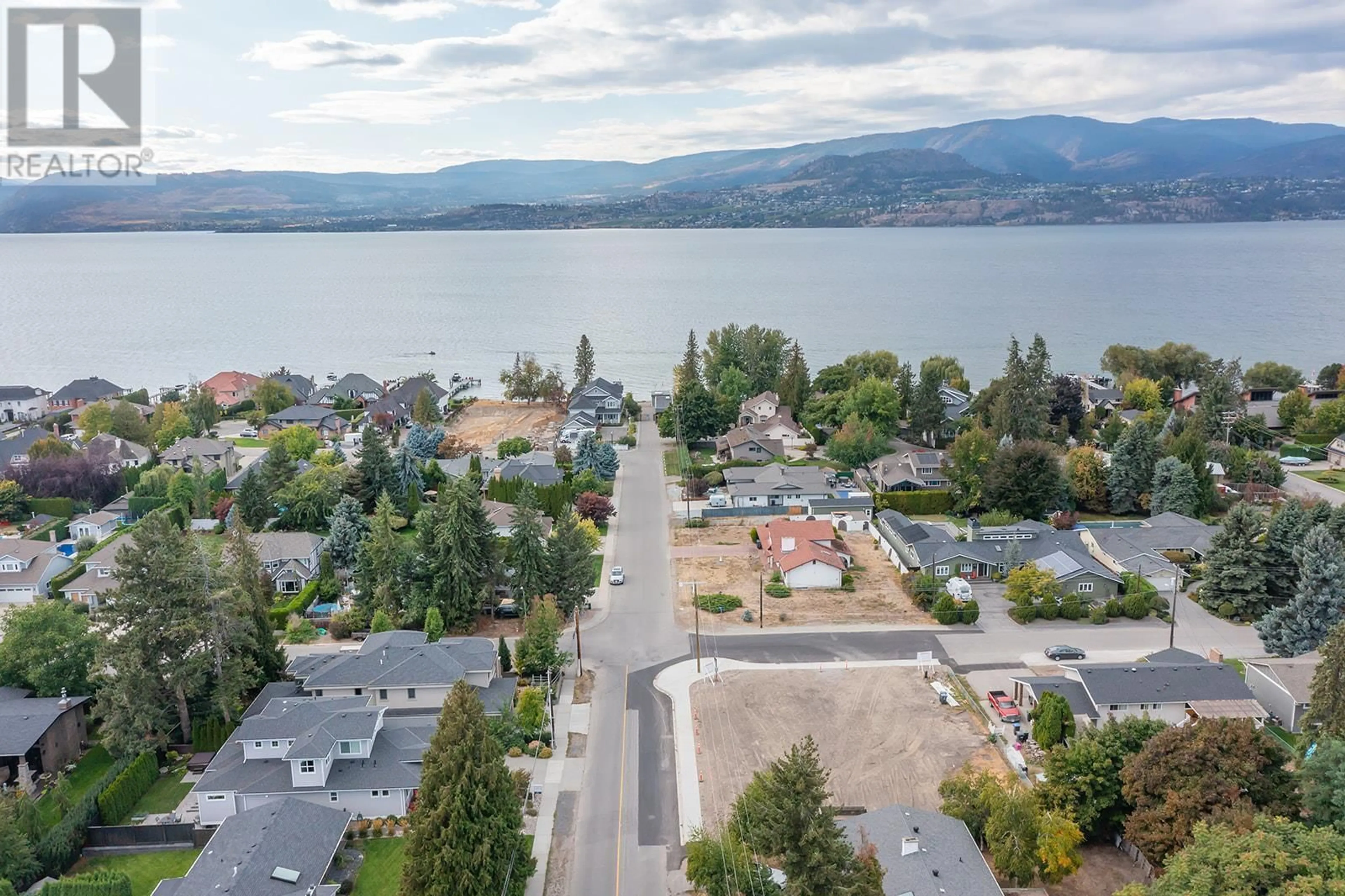 A pic from outside/outdoor area/front of a property/back of a property/a pic from drone, water/lake/river/ocean view for 4499 Walker Road Unit# 1, Kelowna British Columbia V1W1G8