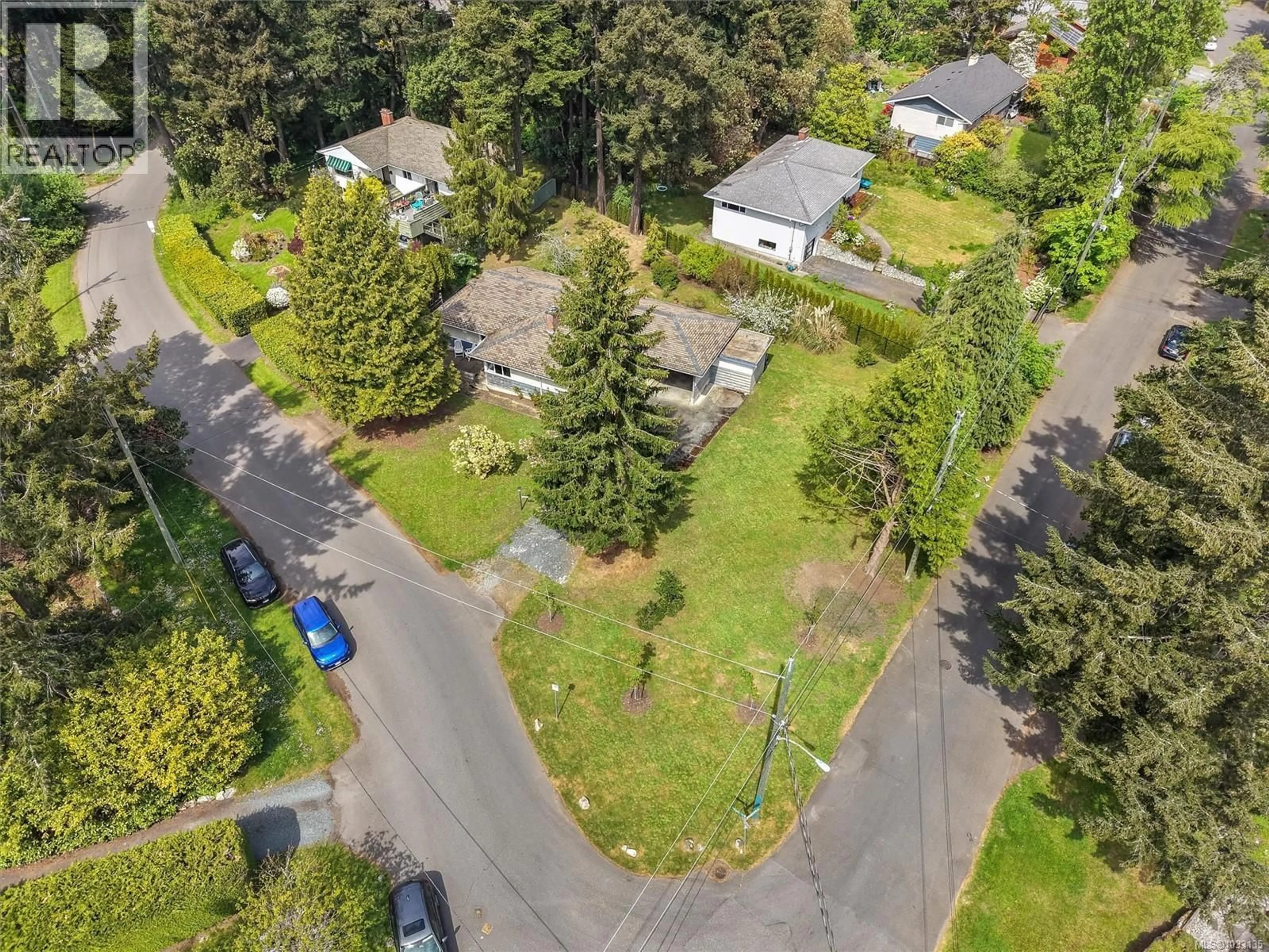 A pic from outside/outdoor area/front of a property/back of a property/a pic from drone, street for 4047 HARO ROAD, Saanich British Columbia V8N4B3