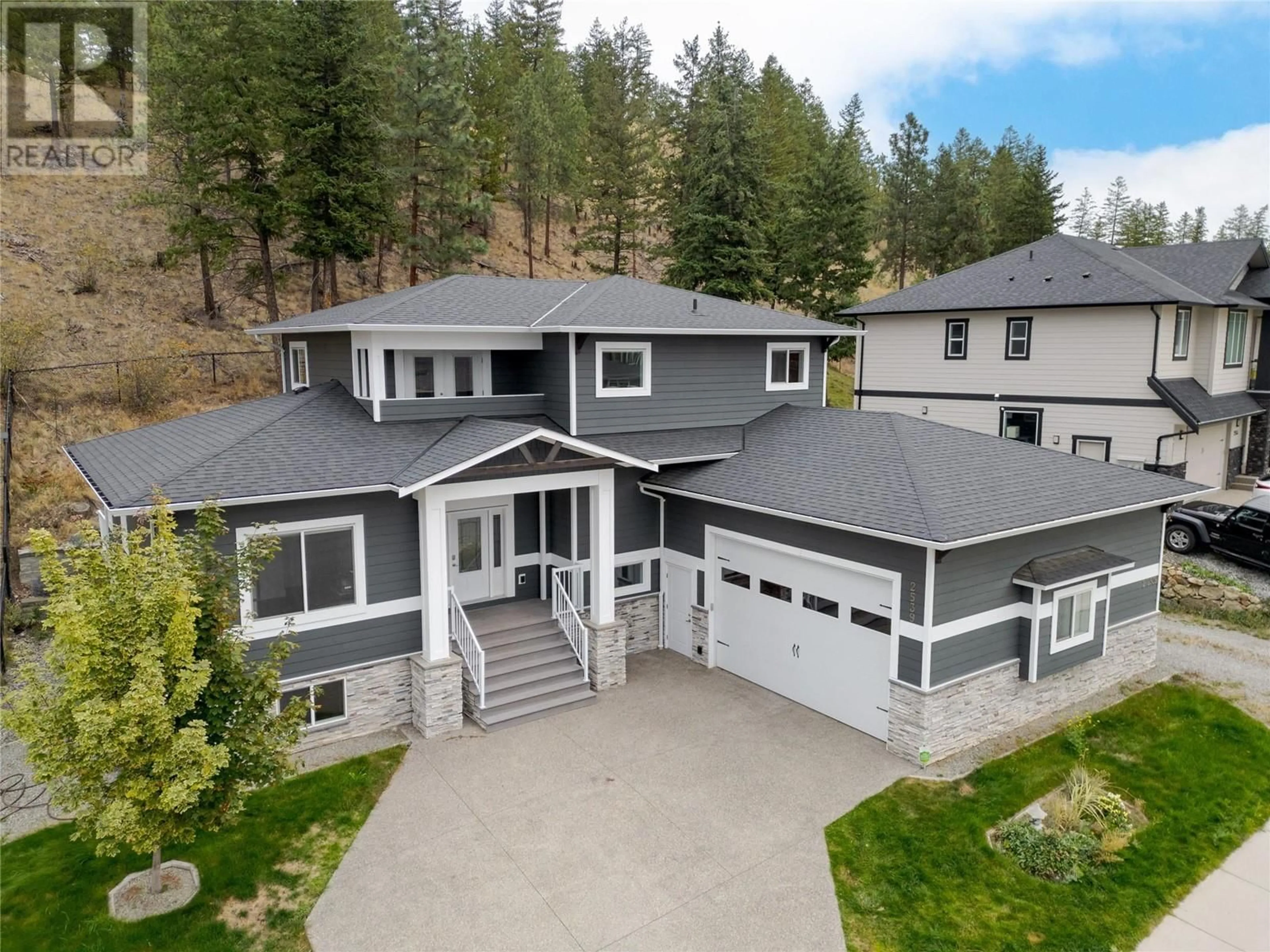 A pic from outside/outdoor area/front of a property/back of a property/a pic from drone, mountain view for 2539 Loseth Road, Kelowna British Columbia V1P1S6