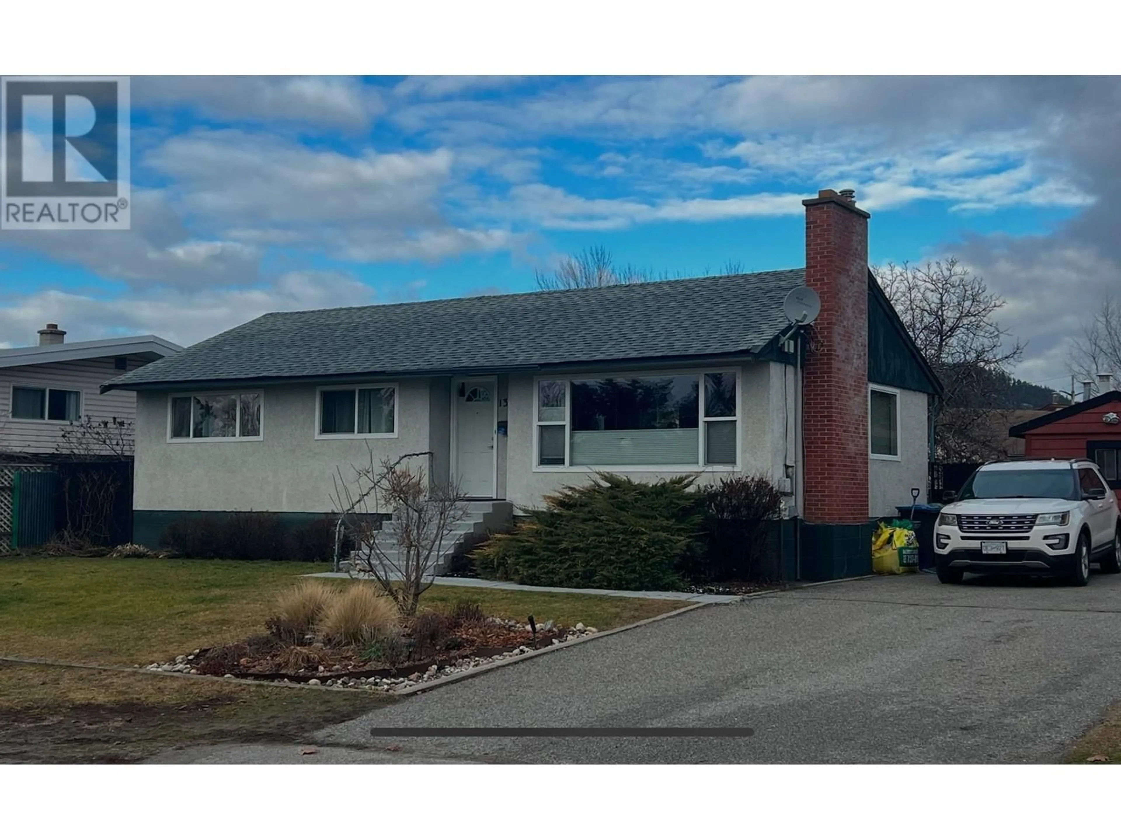 Home with vinyl exterior material, street for 1368 BING AVENUE, Kelowna British Columbia V1Y3Y4