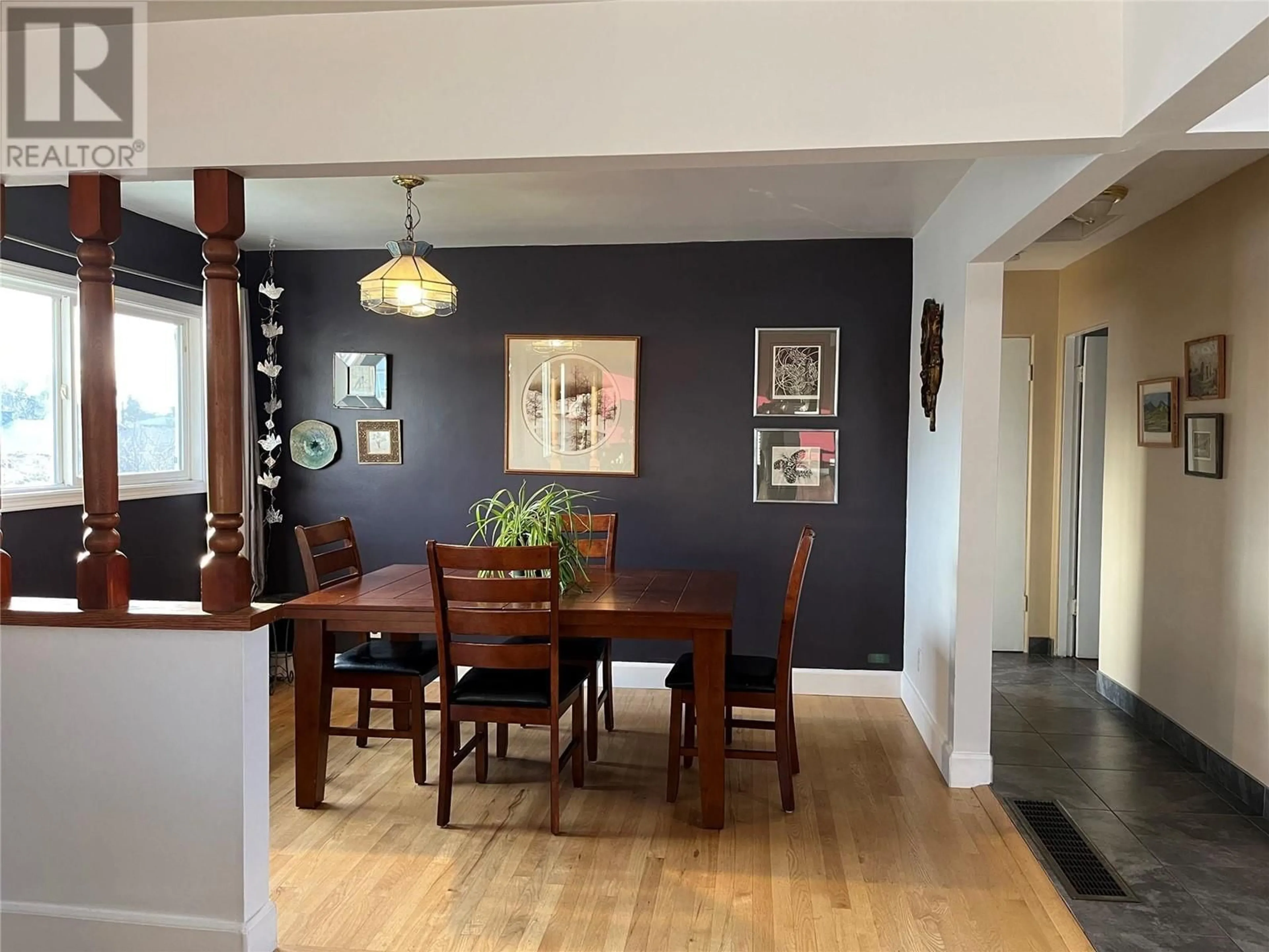 Dining room, wood/laminate floor for 1368 Bing Avenue, Kelowna British Columbia V1Y3Y4