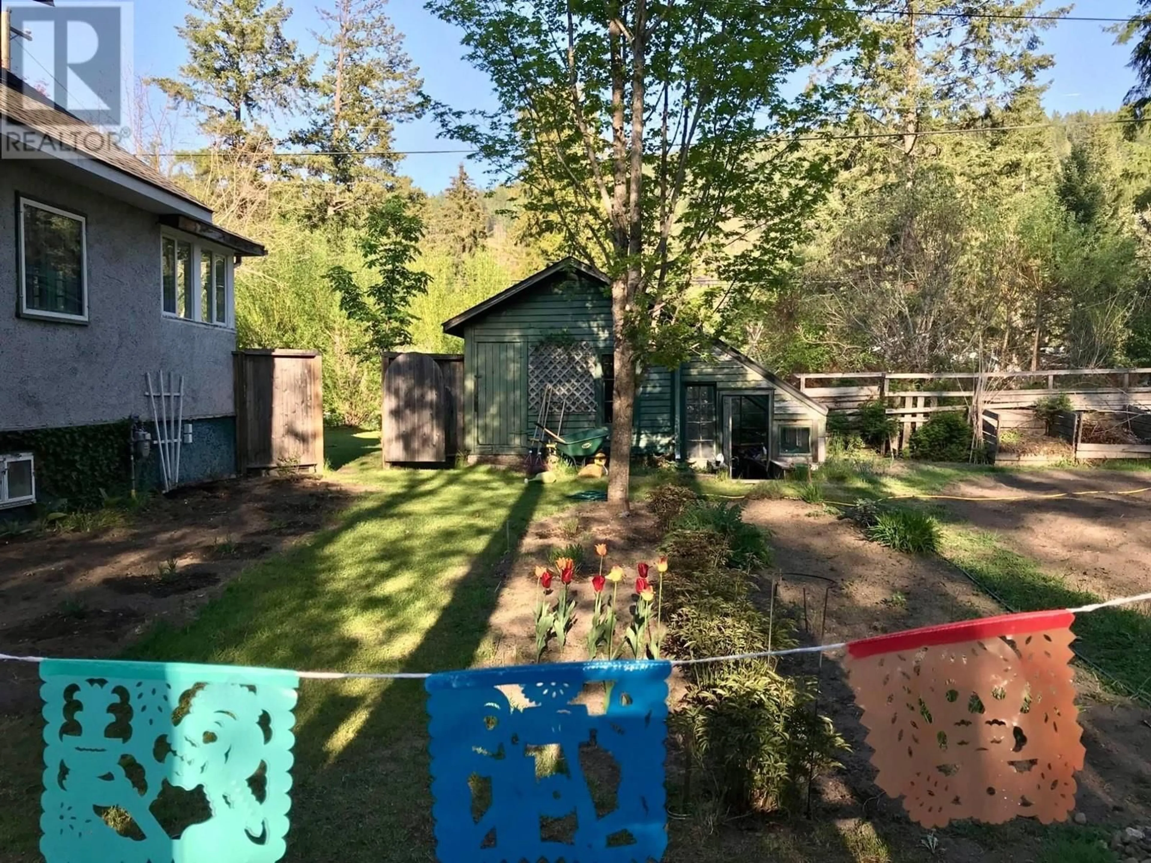 A pic from outside/outdoor area/front of a property/back of a property/a pic from drone, forest/trees view for 1949 FIFE Road, Christina Lake British Columbia V0H1E0