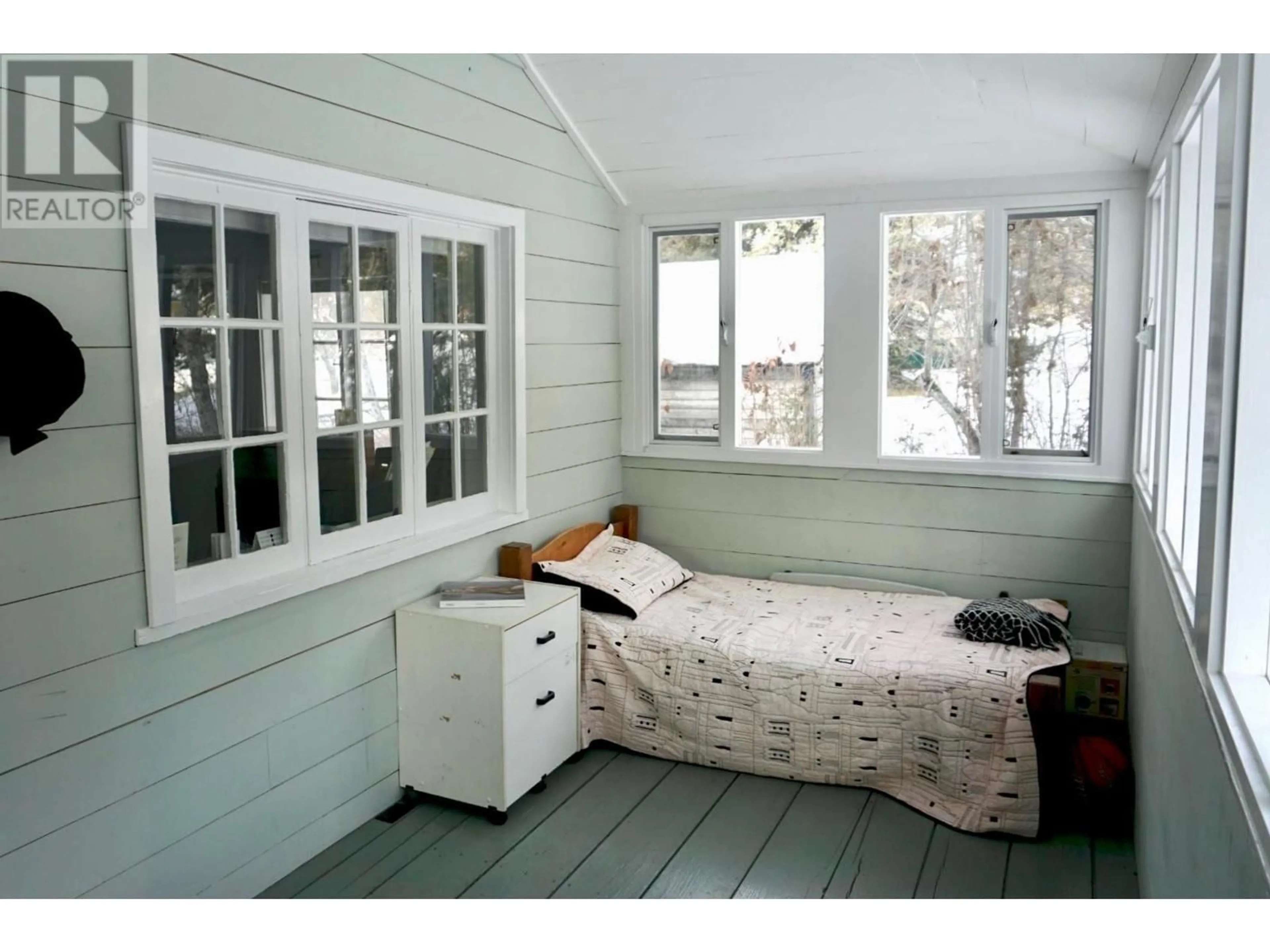 Bedroom with bed, wood/laminate floor for 1949 FIFE Road, Christina Lake British Columbia V0H1E0