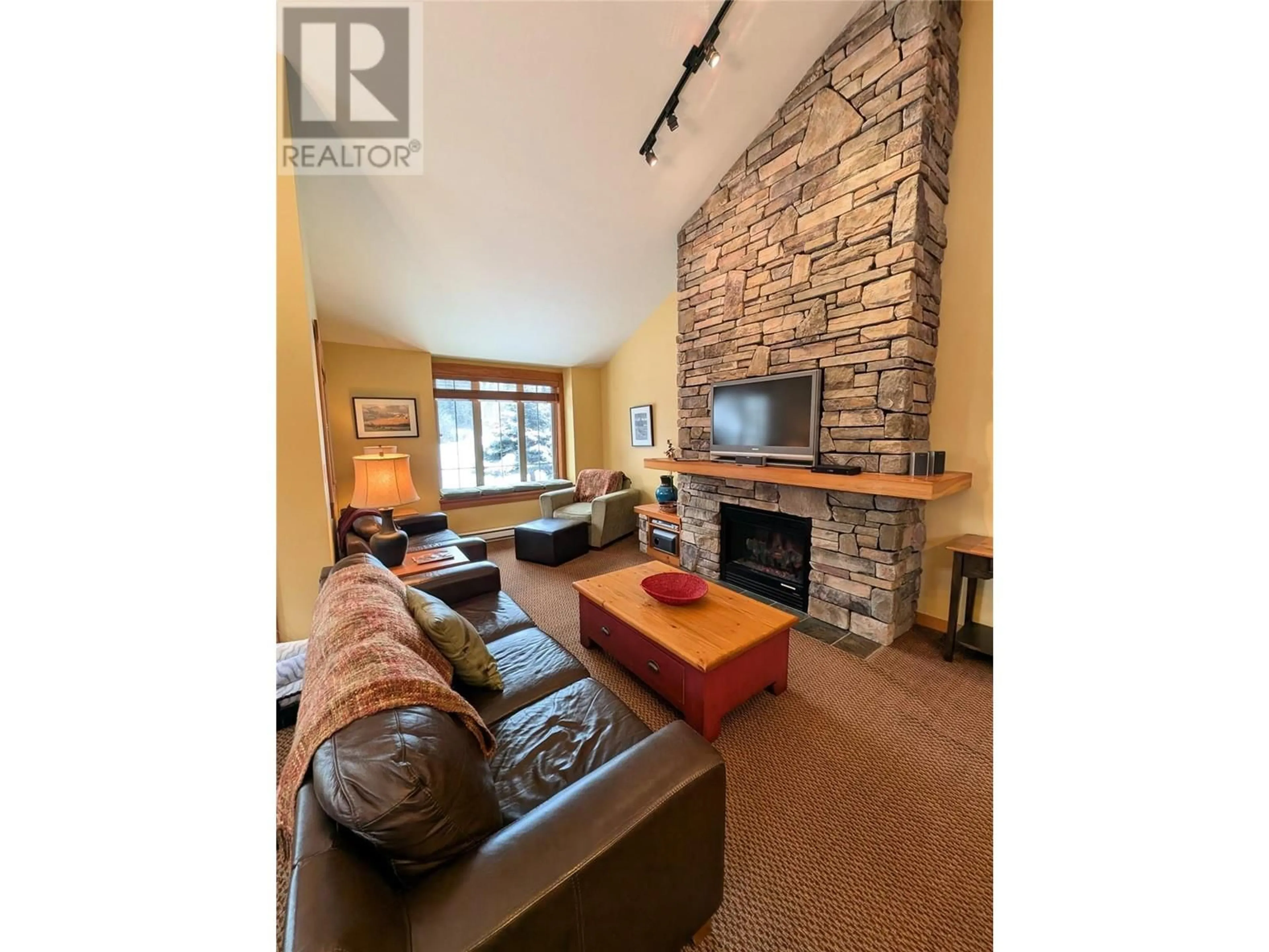 Living room with furniture, wood/laminate floor for 45 RIVERMOUNT Place Unit# 106C, Fernie British Columbia V0B1M7