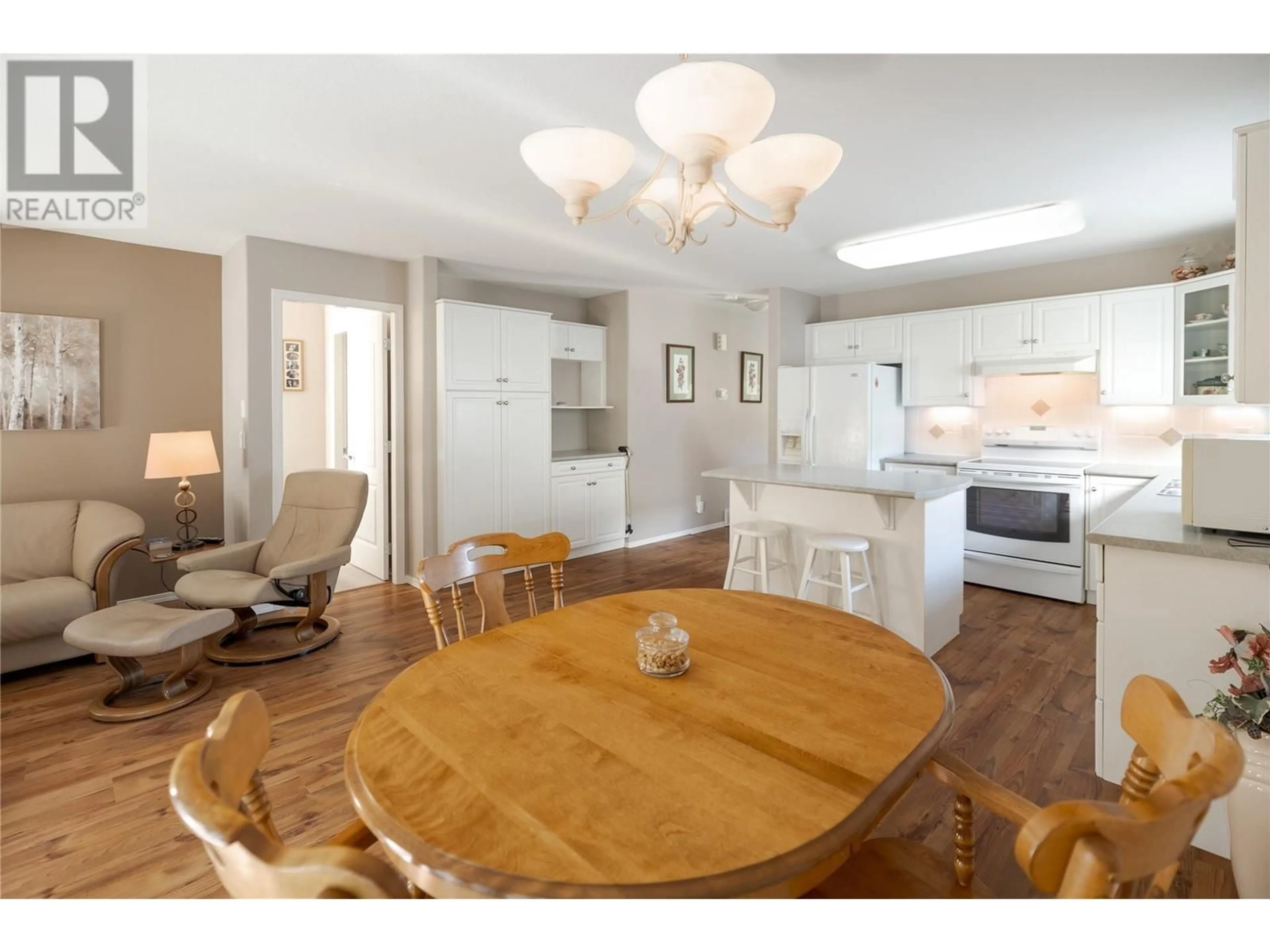 Dining room, wood/laminate floor for 3788 Bird Place Unit# 145, Kelowna British Columbia V1W4T3