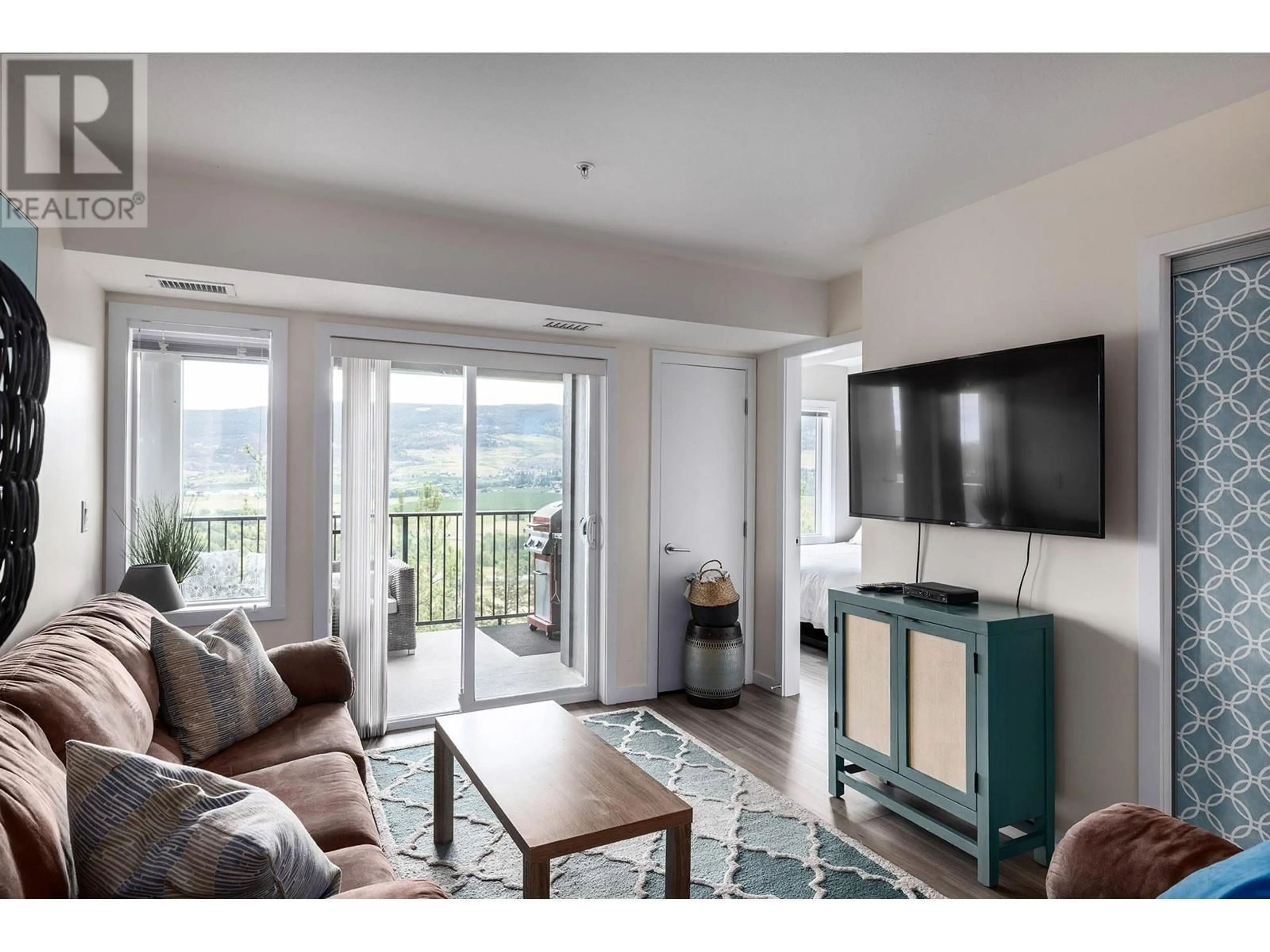 Living room with furniture, unknown for 775 Academy Way Unit# 217, Kelowna British Columbia V1V3C8