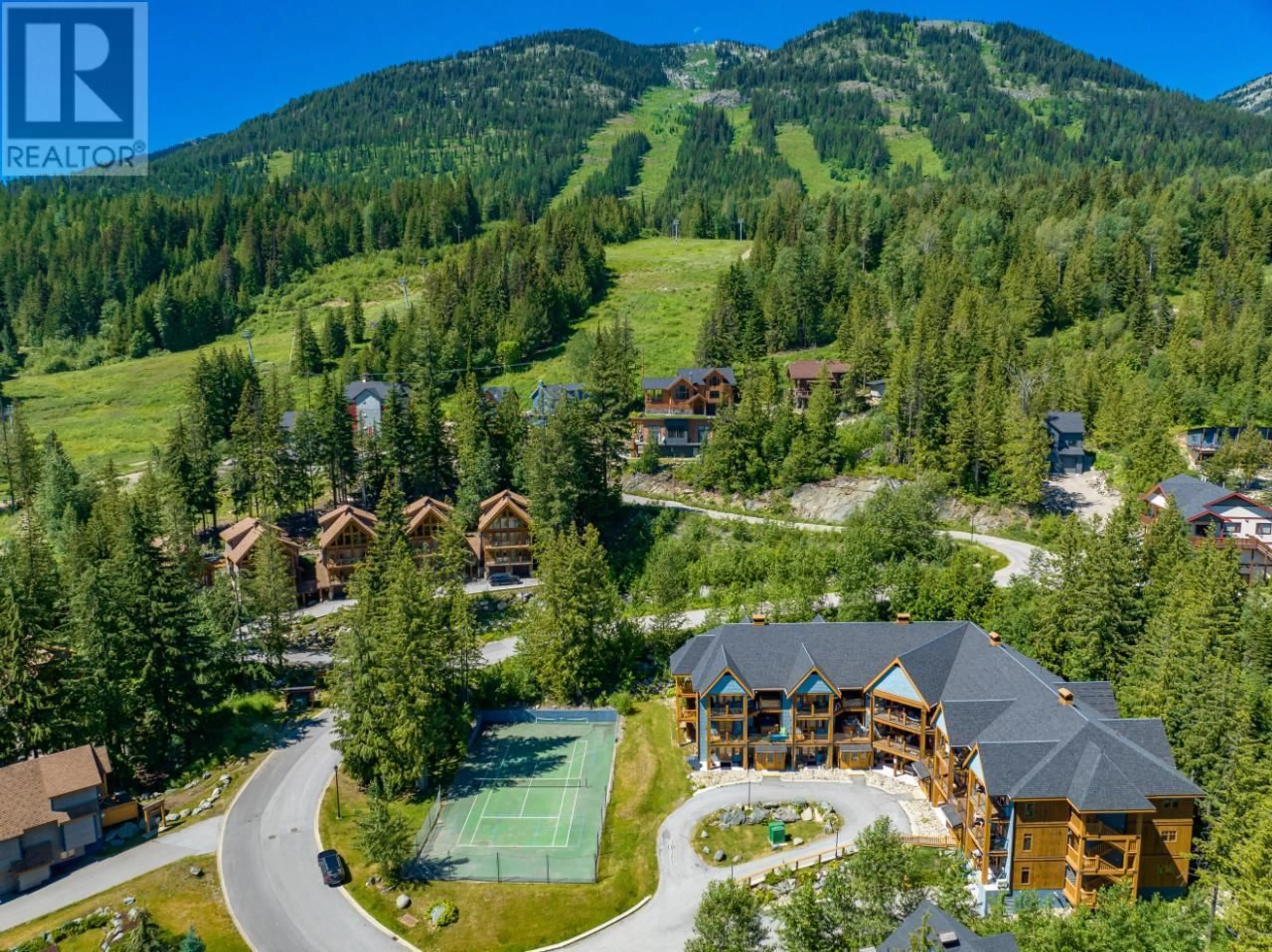 A pic from outside/outdoor area/front of a property/back of a property/a pic from drone, mountain view for 1008 Olaus Way Unit# 7, Rossland British Columbia V0G1Y0