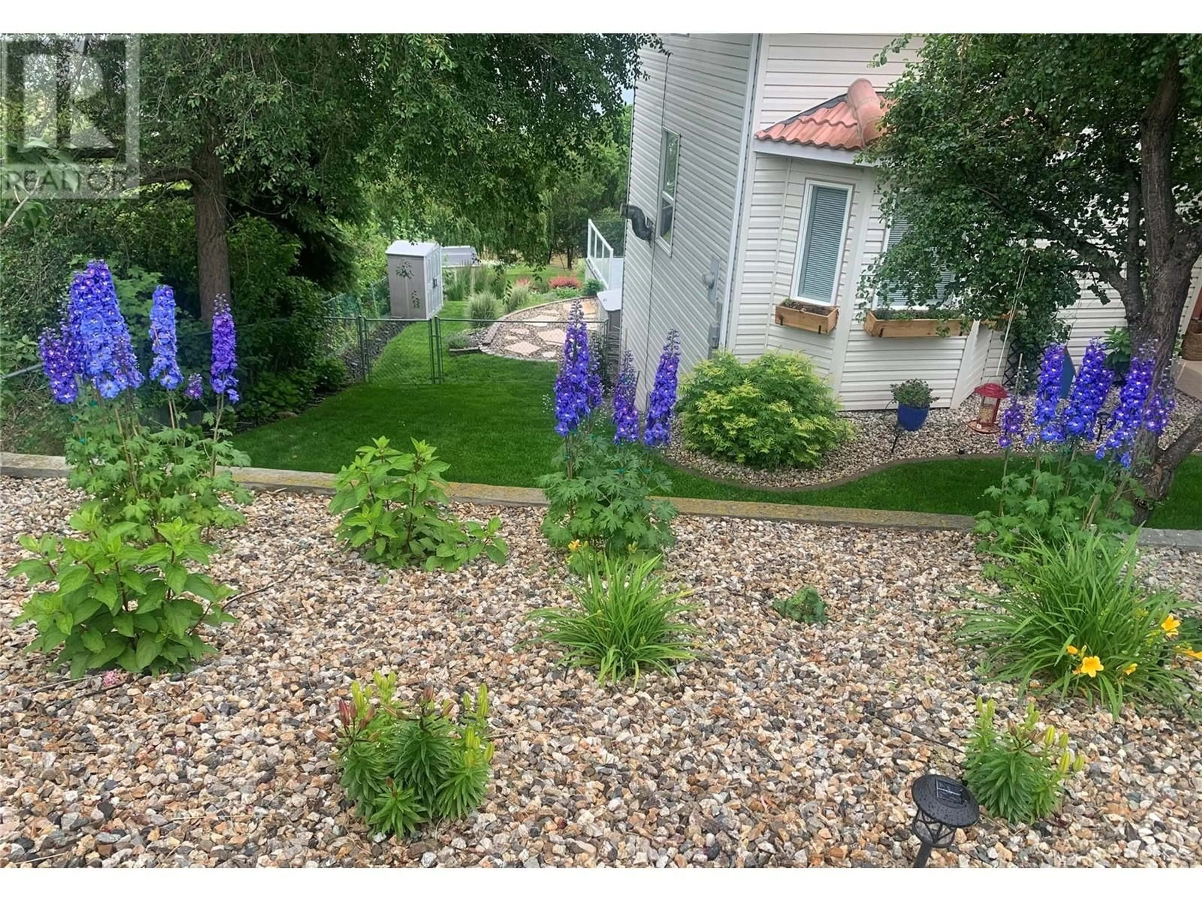 A pic from outside/outdoor area/front of a property/back of a property/a pic from drone, street for 6057 Ellison Avenue, Peachland British Columbia V0H1X4