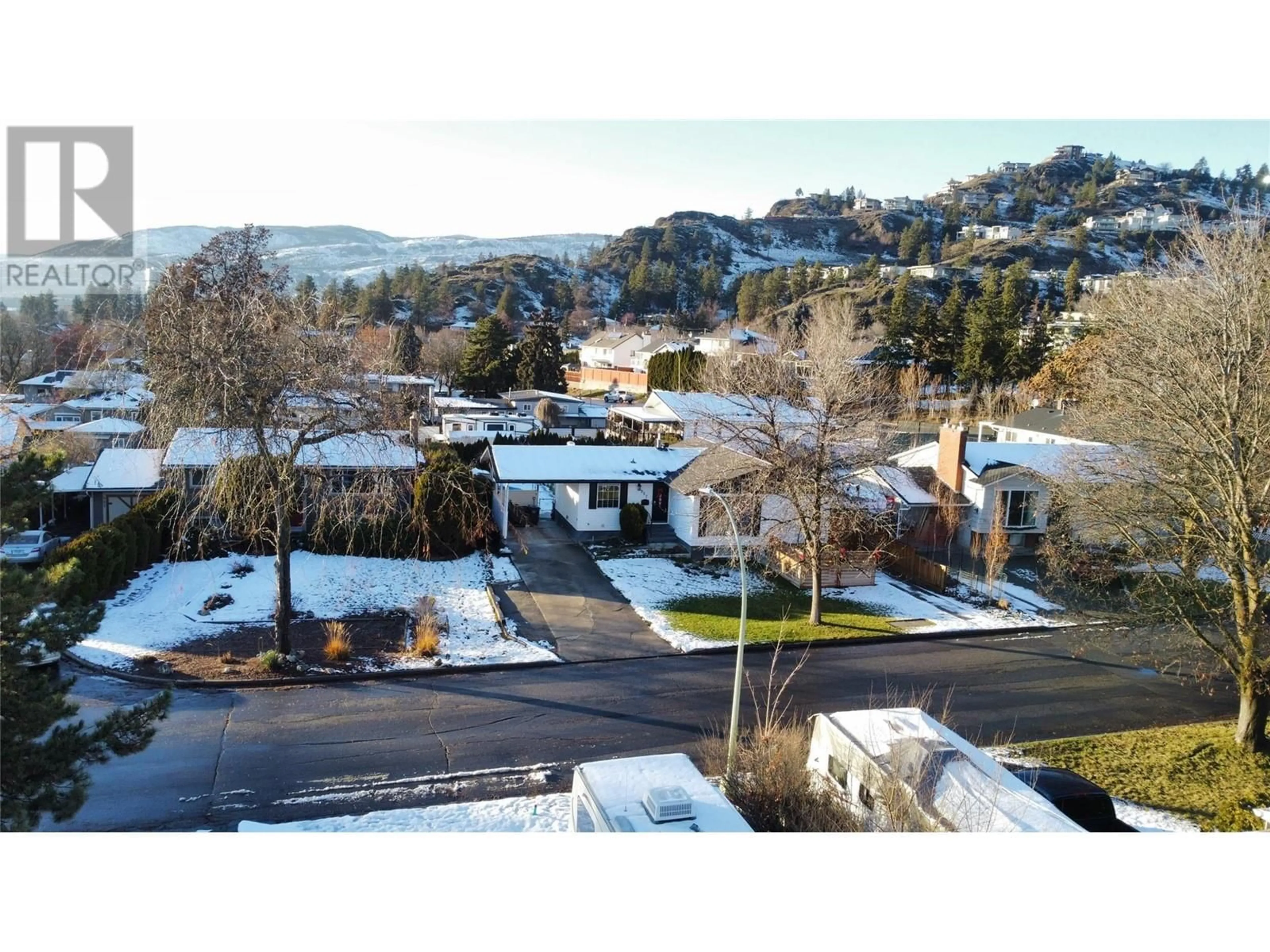 A pic from outside/outdoor area/front of a property/back of a property/a pic from drone, mountain view for 964 Tronson Drive, Kelowna British Columbia V1Y4E1