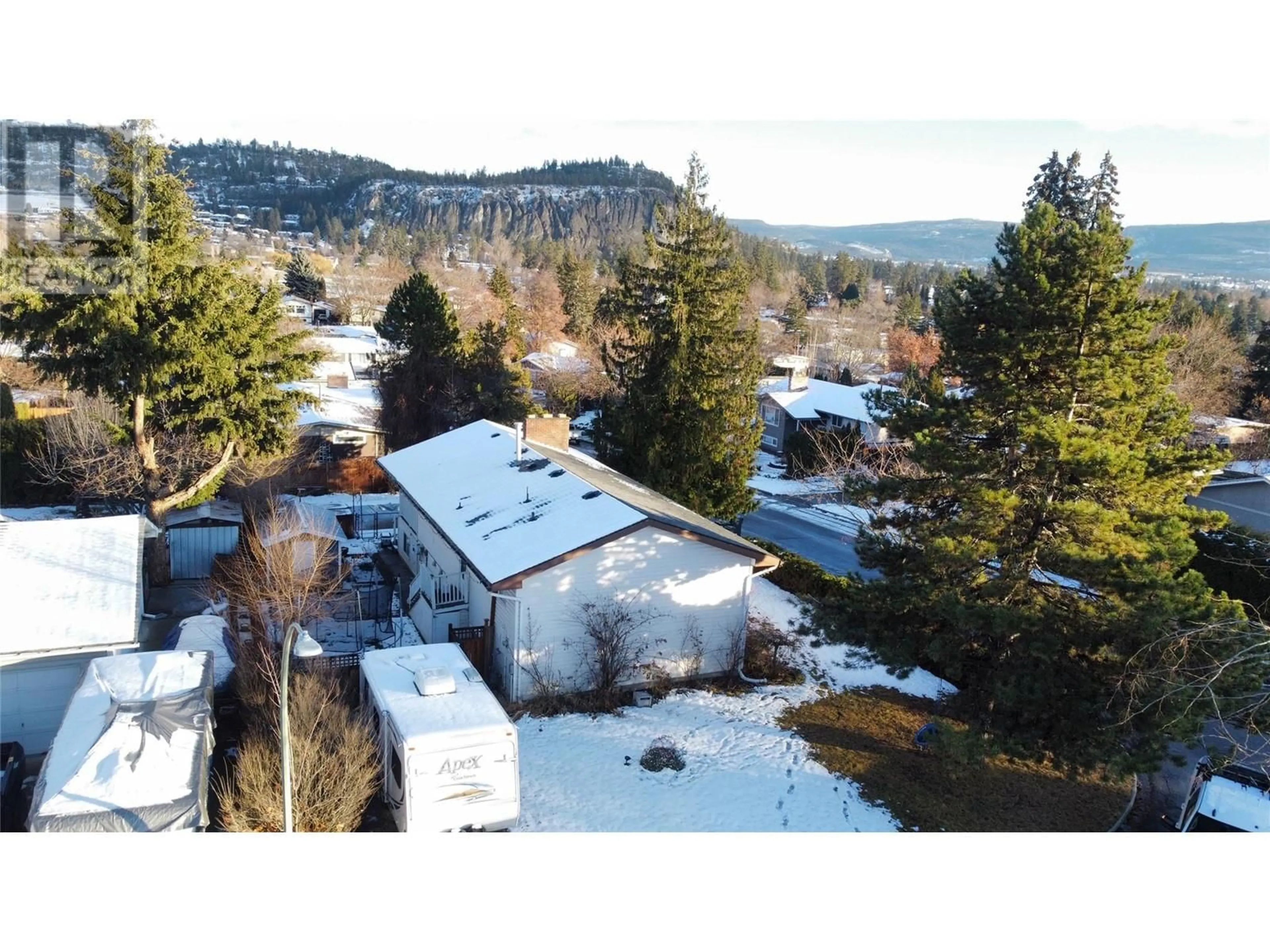 A pic from outside/outdoor area/front of a property/back of a property/a pic from drone, mountain view for 964 Tronson Drive, Kelowna British Columbia V1Y4E1