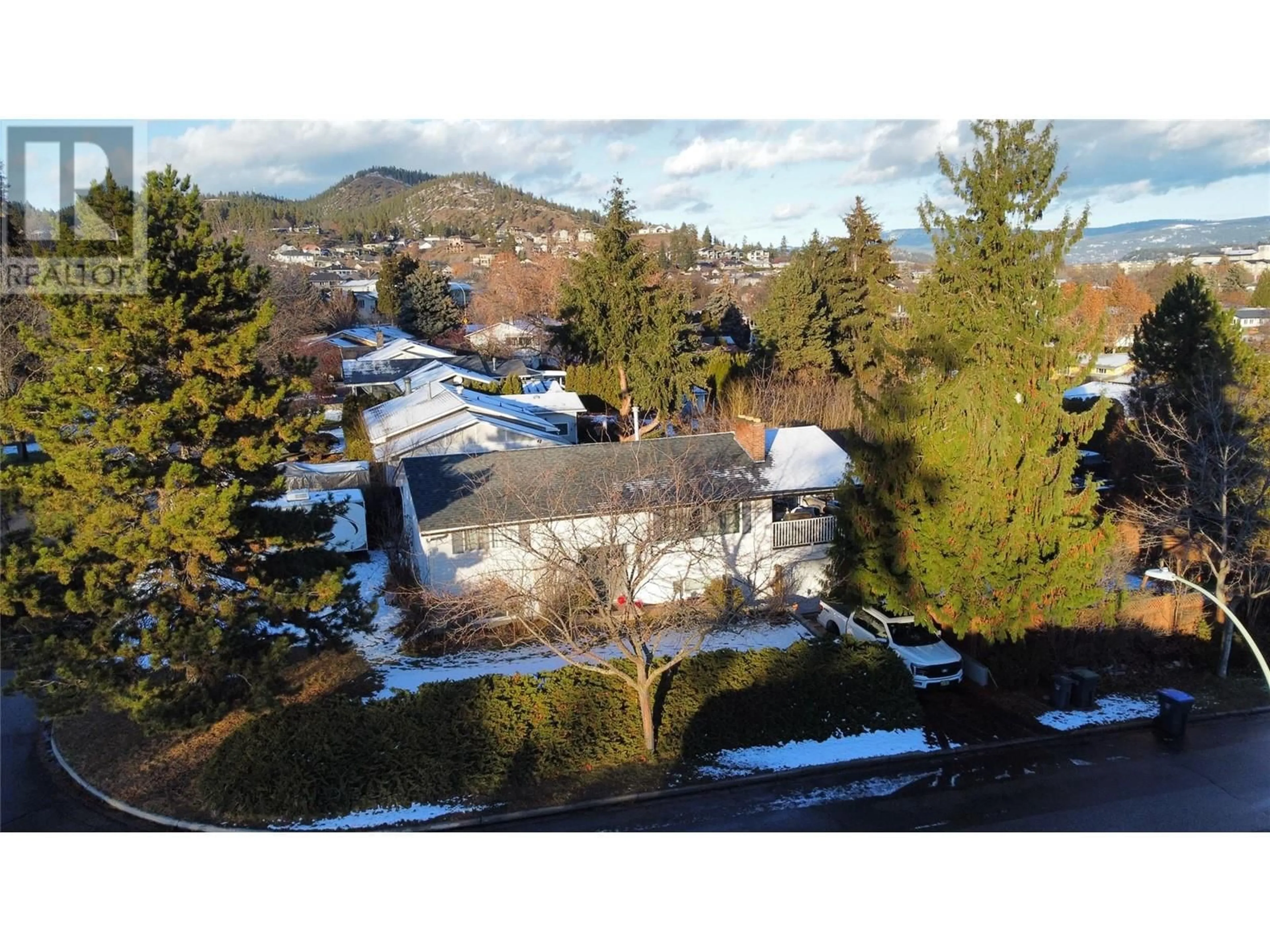 A pic from outside/outdoor area/front of a property/back of a property/a pic from drone, mountain view for 964 Tronson Drive, Kelowna British Columbia V1Y4E1