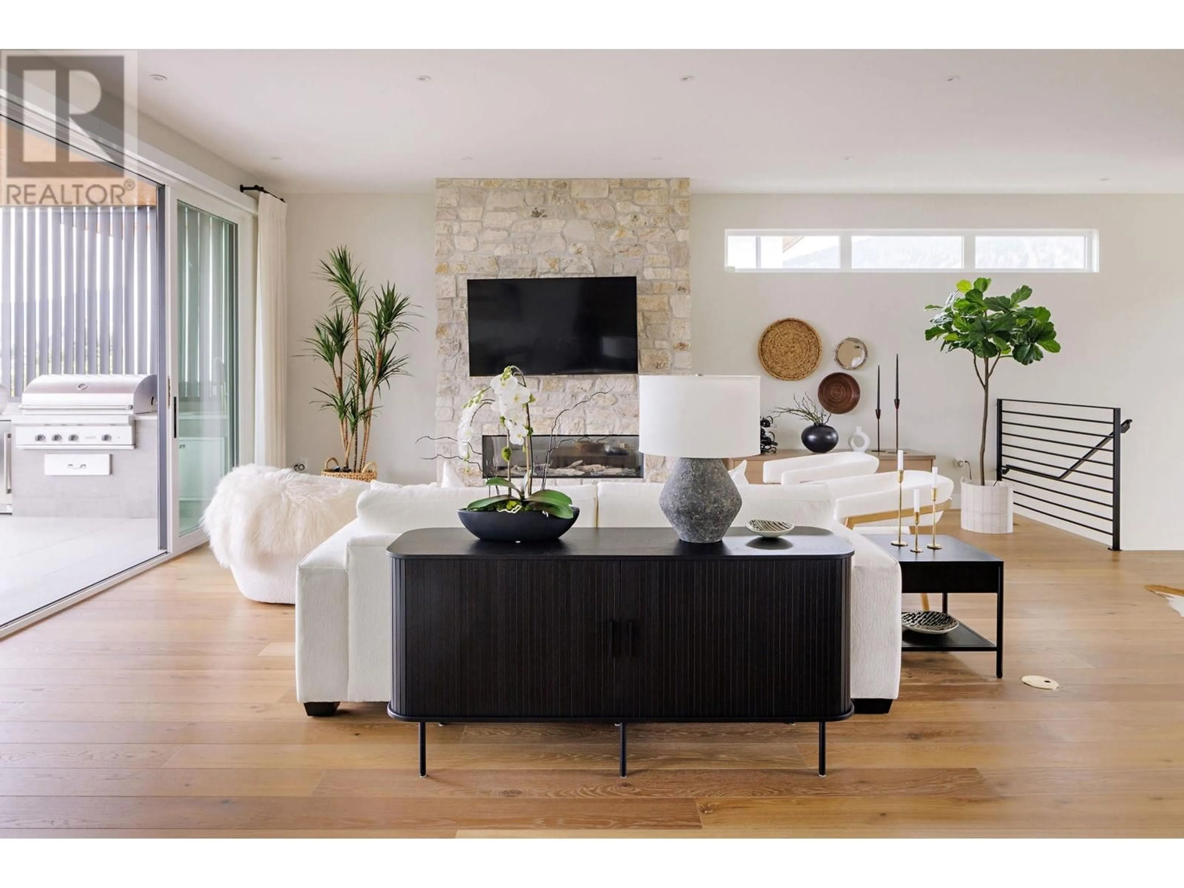 Living room with furniture, wood/laminate floor for 140 Oliver Place, Penticton British Columbia V2A0H1