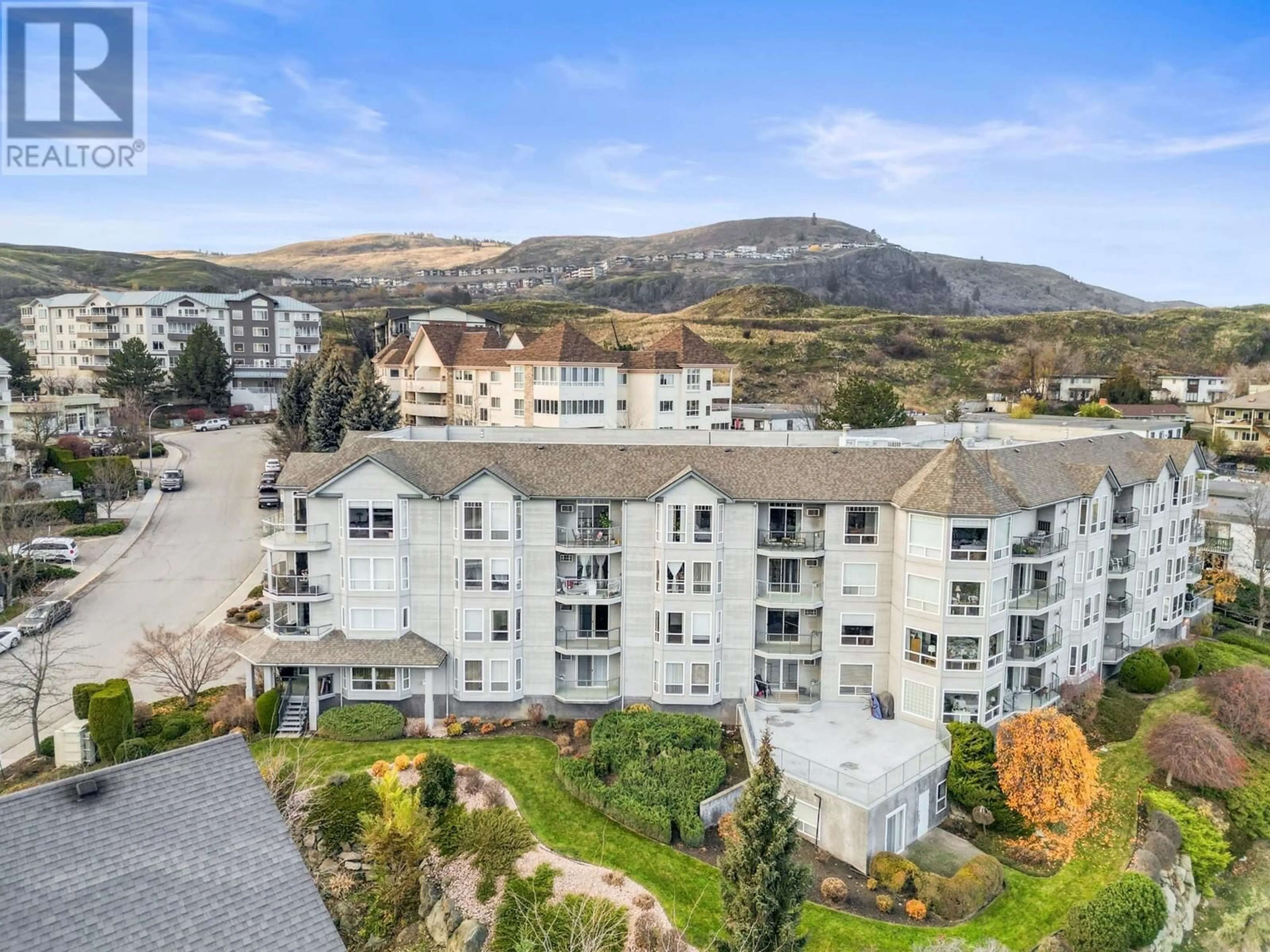 A pic from outside/outdoor area/front of a property/back of a property/a pic from drone, mountain view for 3221 Centennial Drive Unit# 203, Vernon British Columbia V1T2T8