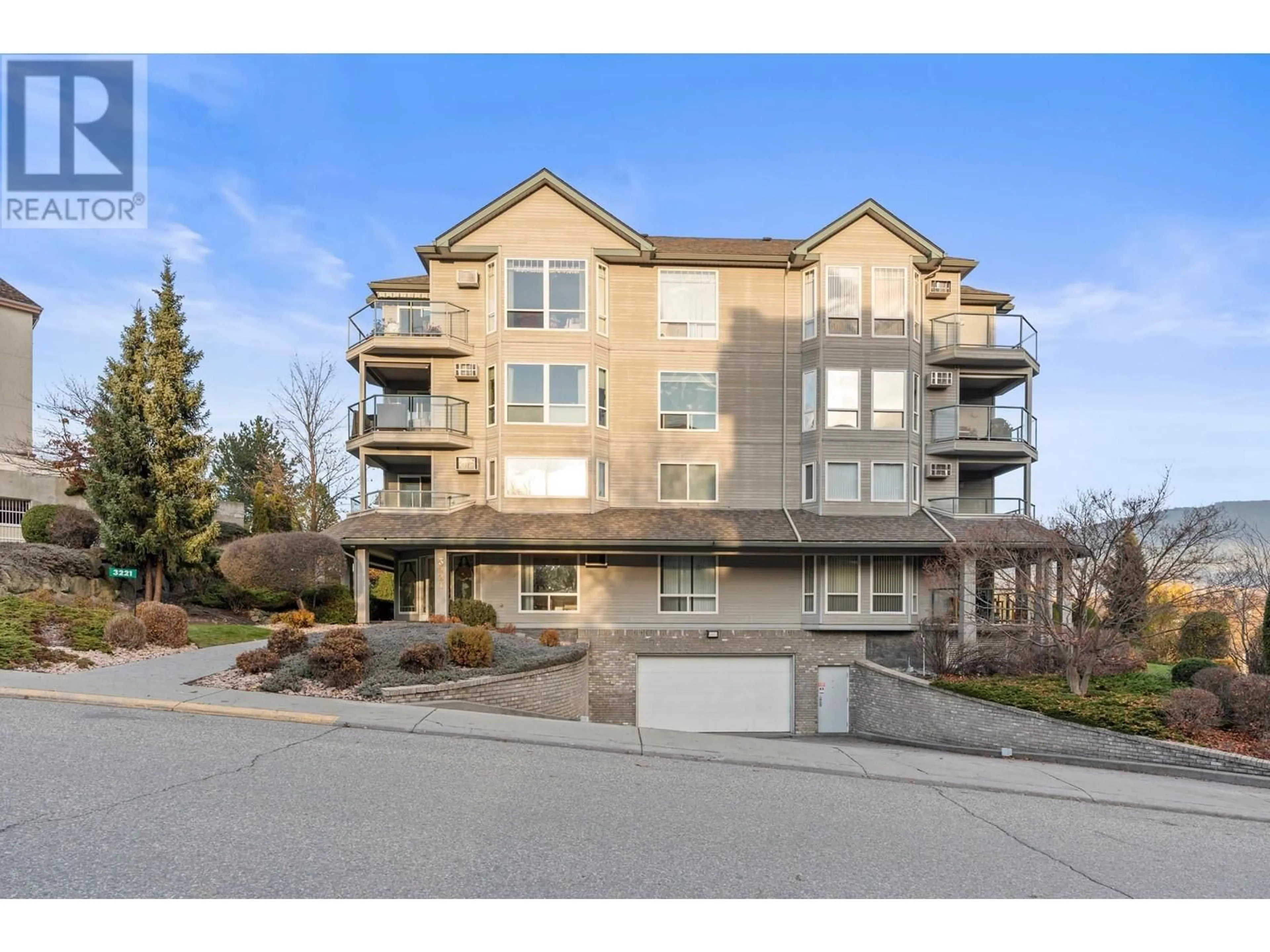 A pic from outside/outdoor area/front of a property/back of a property/a pic from drone, unknown for 3221 Centennial Drive Unit# 203, Vernon British Columbia V1T2T8