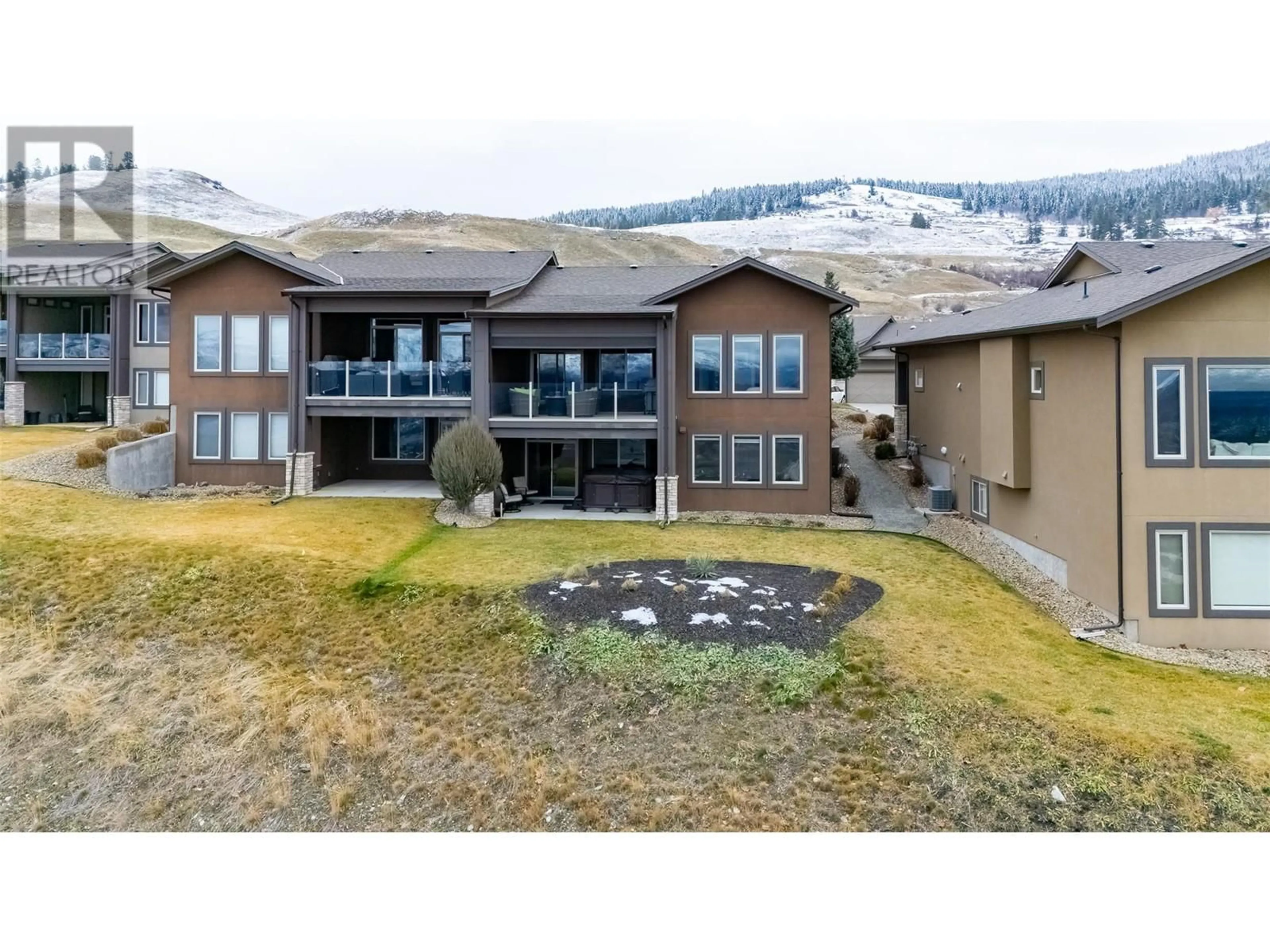 A pic from outside/outdoor area/front of a property/back of a property/a pic from drone, mountain view for 1836 Tower Ranch Boulevard Unit# 5, Kelowna British Columbia V1P1S8