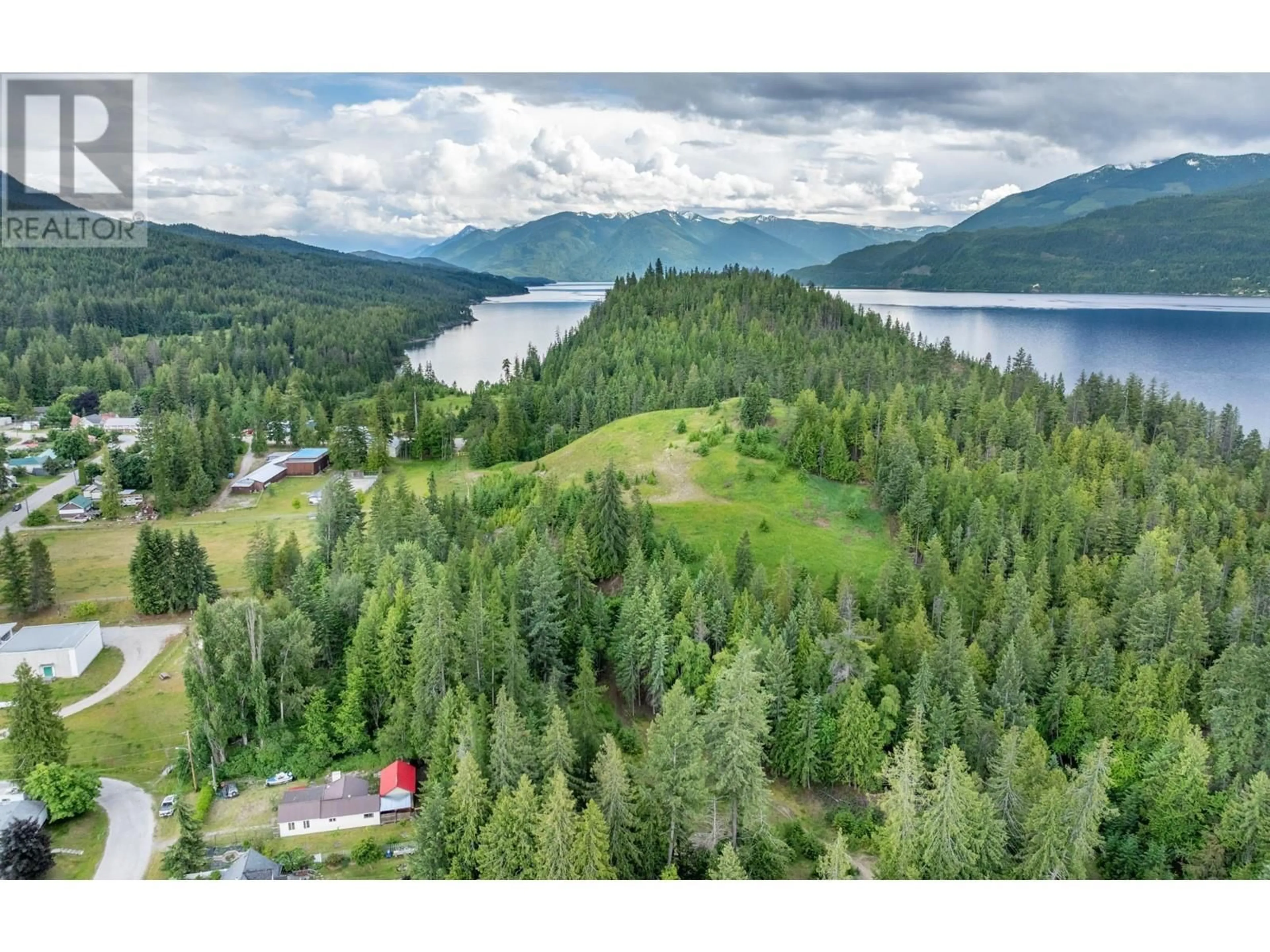 A pic from outside/outdoor area/front of a property/back of a property/a pic from drone, water/lake/river/ocean view for 1521 Hearst Avenue, Riondel British Columbia V0B2B0