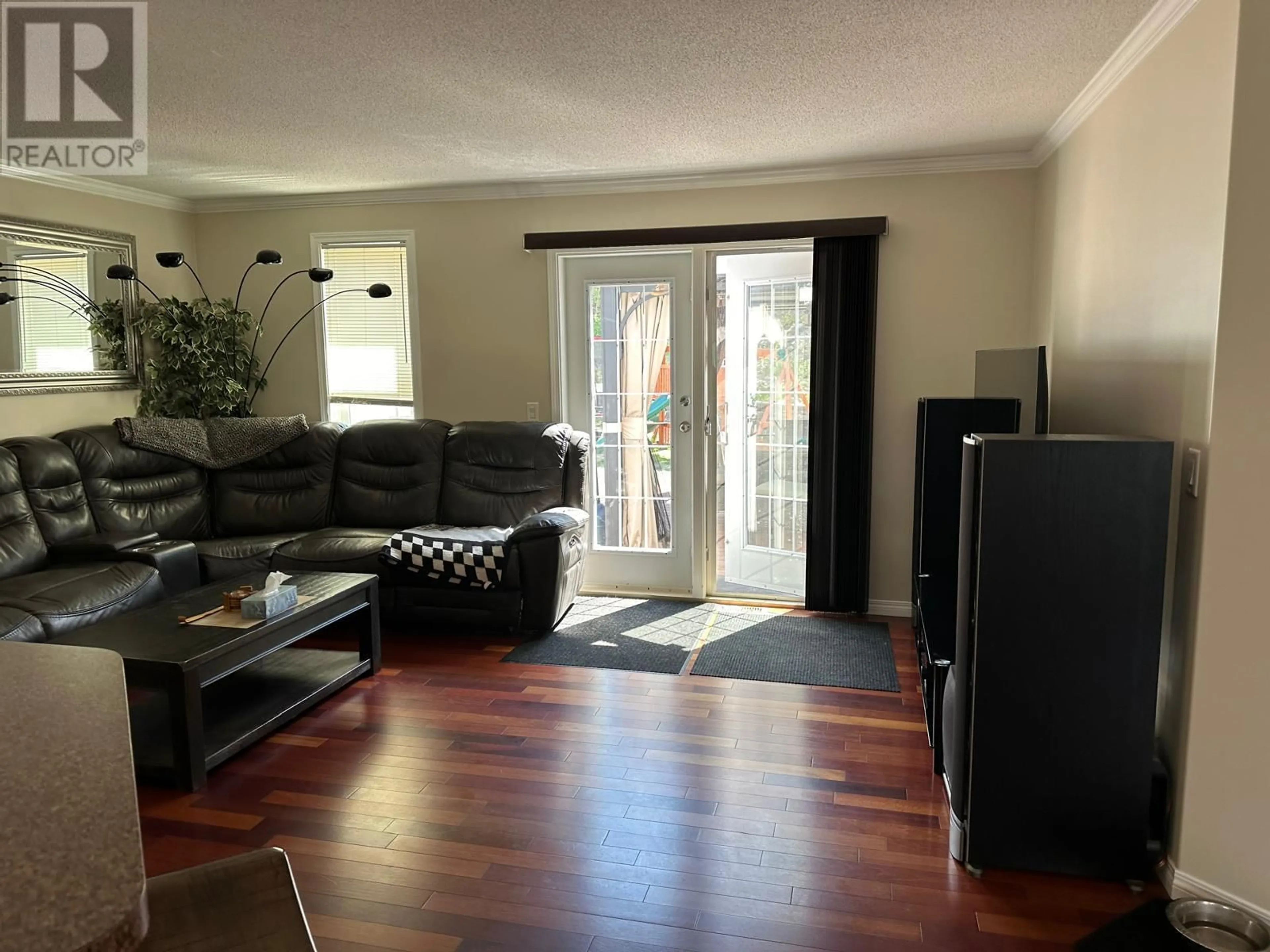 Living room with furniture, wood/laminate floor for 151 KINUSEO AVENUE, Tumbler Ridge British Columbia V0C2W0