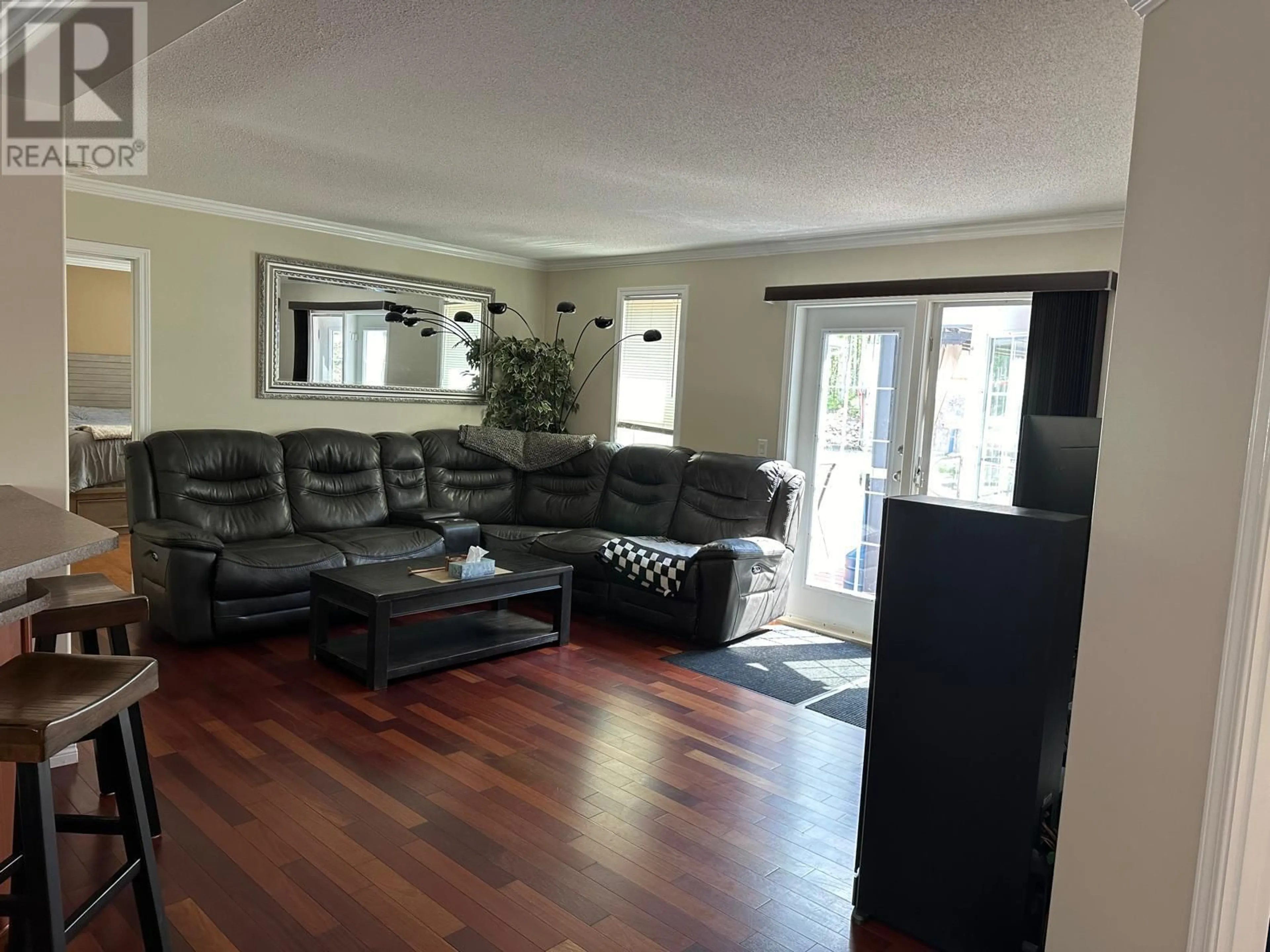 Living room with furniture, wood/laminate floor for 151 Kinuseo Avenue, Tumbler Ridge British Columbia V0C2W0