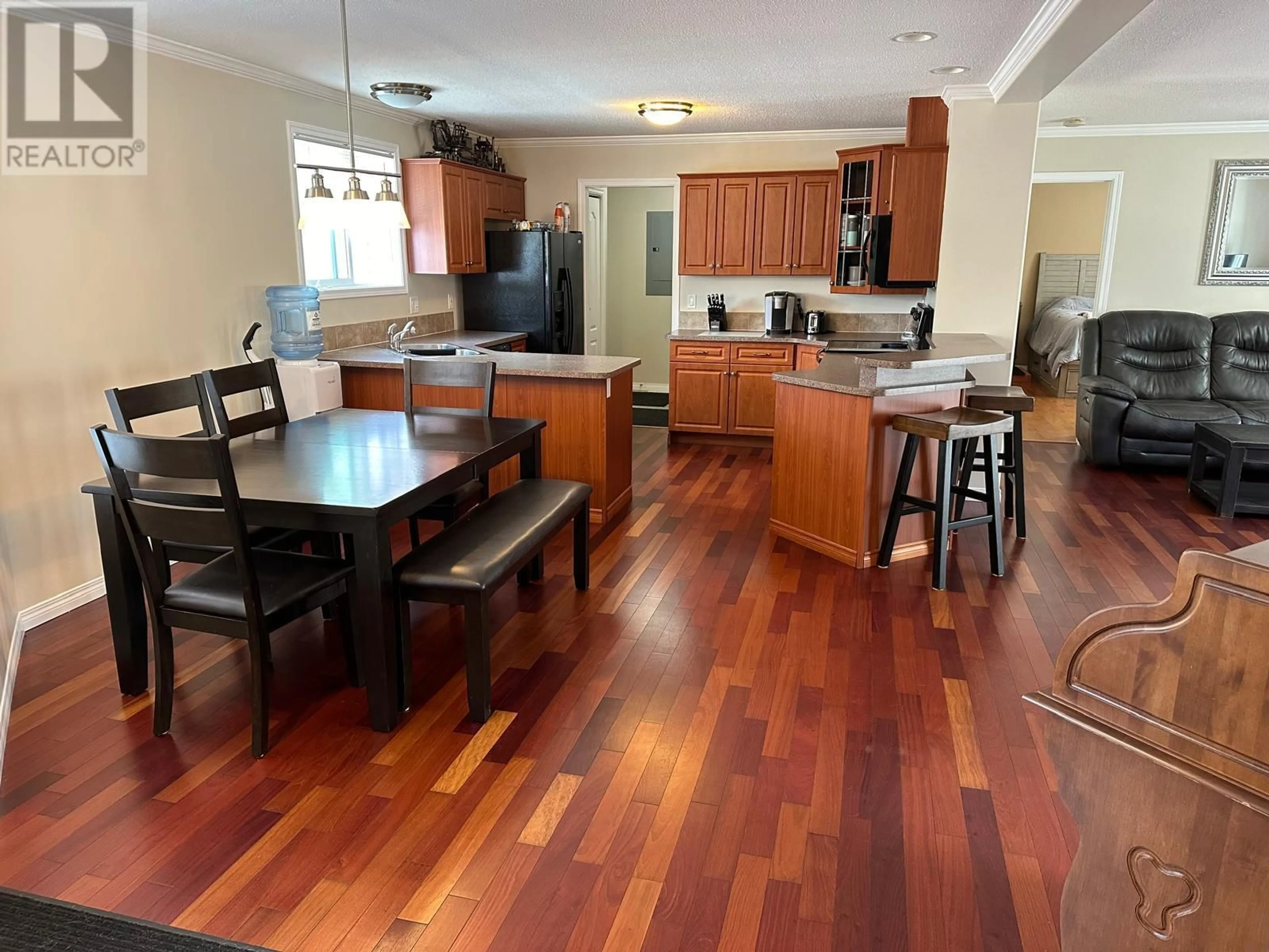 Open concept kitchen, wood/laminate floor for 151 Kinuseo Avenue, Tumbler Ridge British Columbia V0C2W0