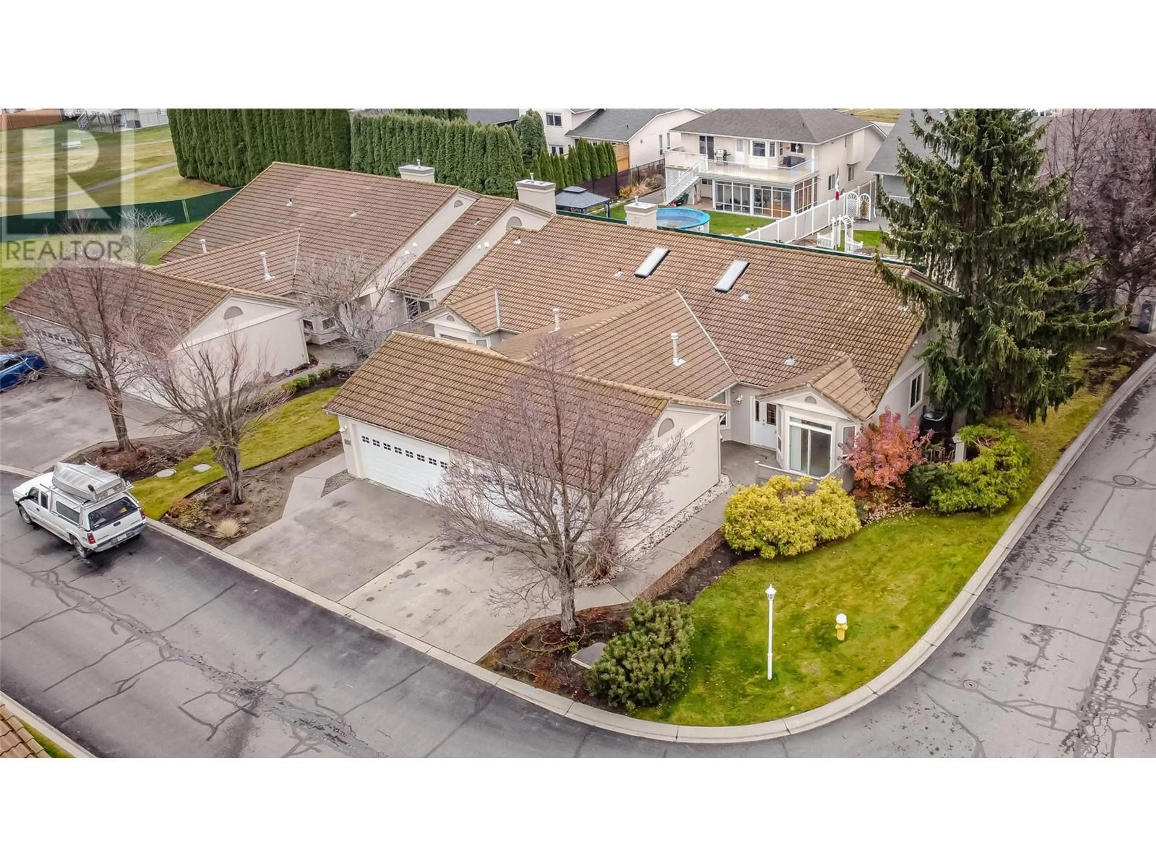 A pic from outside/outdoor area/front of a property/back of a property/a pic from drone, street for 650 Harrington Road Unit# 102, Kamloops British Columbia V2B6T7