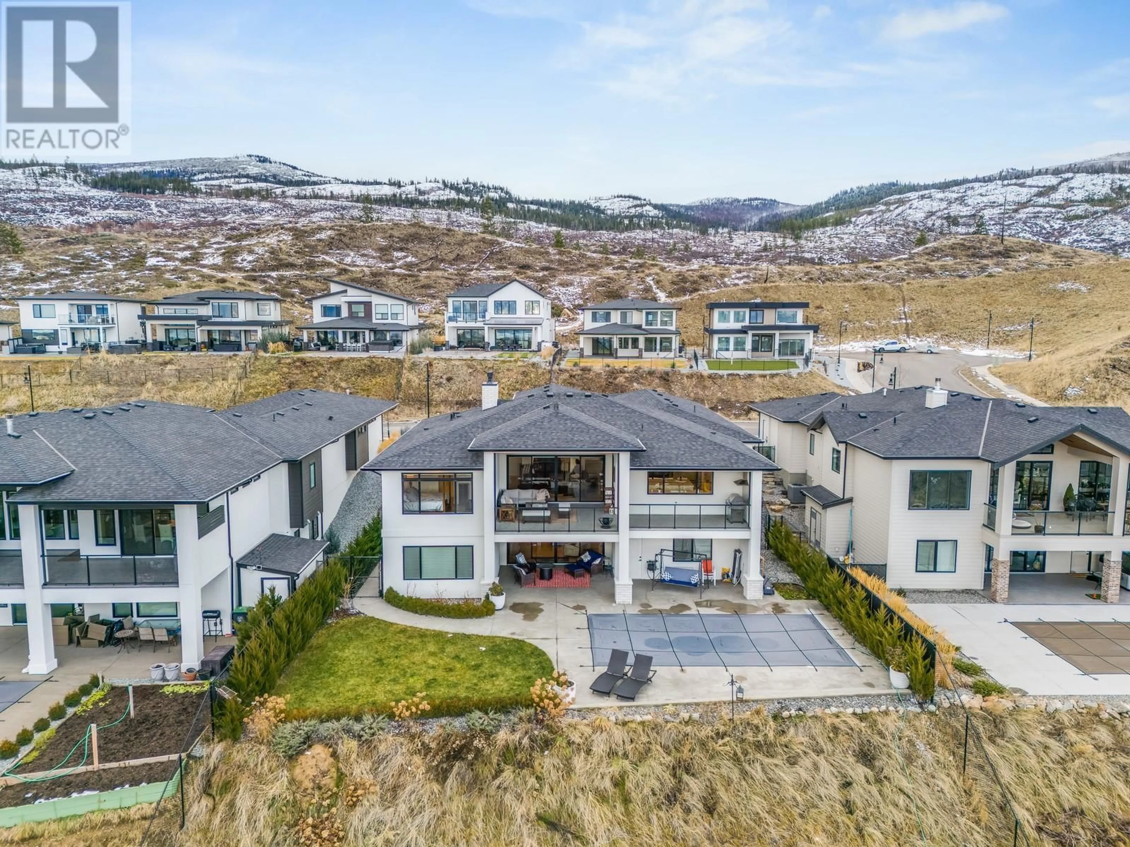 A pic from outside/outdoor area/front of a property/back of a property/a pic from drone, mountain view for 1570 Antler Court, Kelowna British Columbia V1W5N9