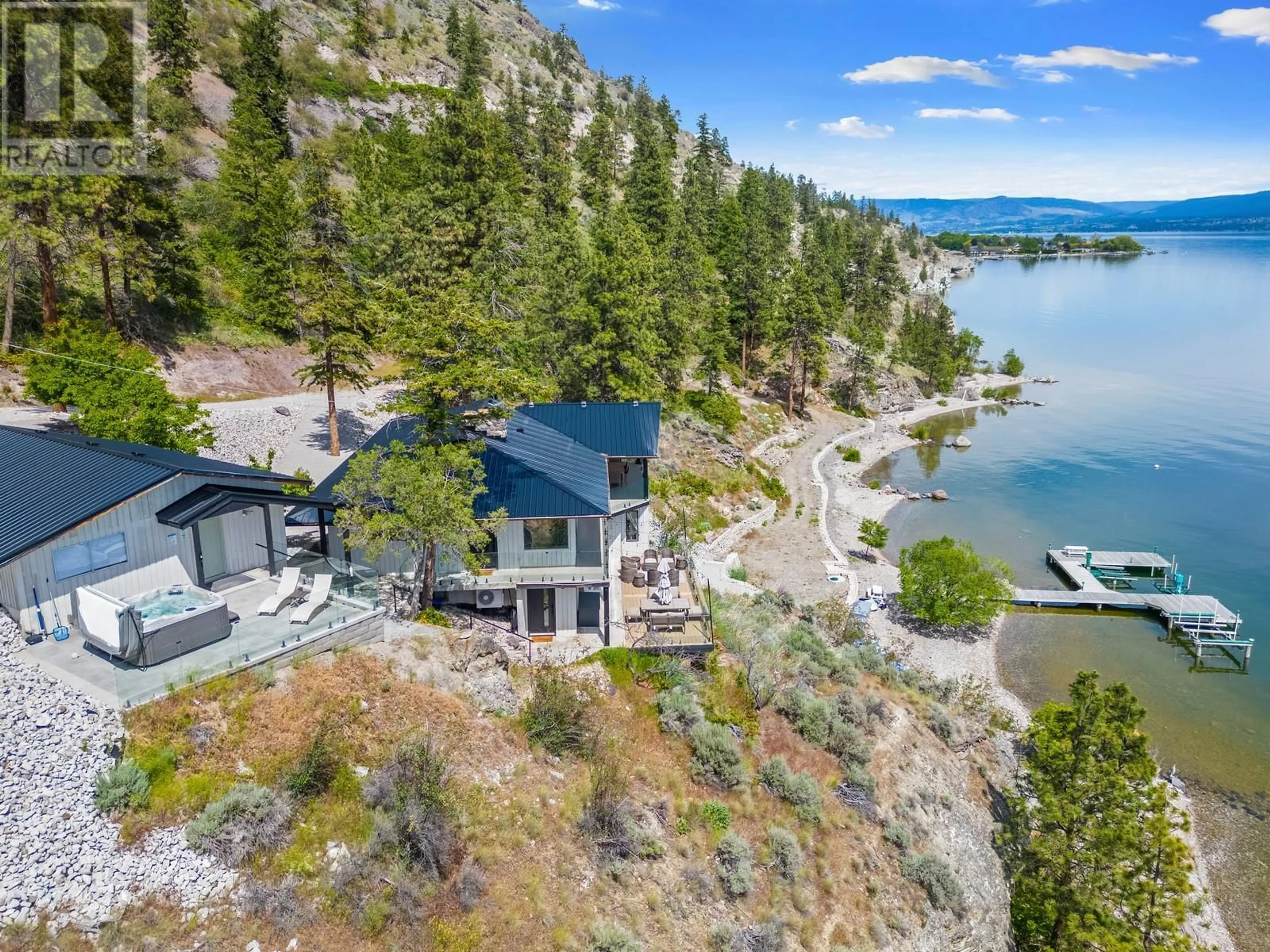 A pic from outside/outdoor area/front of a property/back of a property/a pic from drone, water/lake/river/ocean view for 2888 Seclusion Bay Road, West Kelowna British Columbia V4T1W5