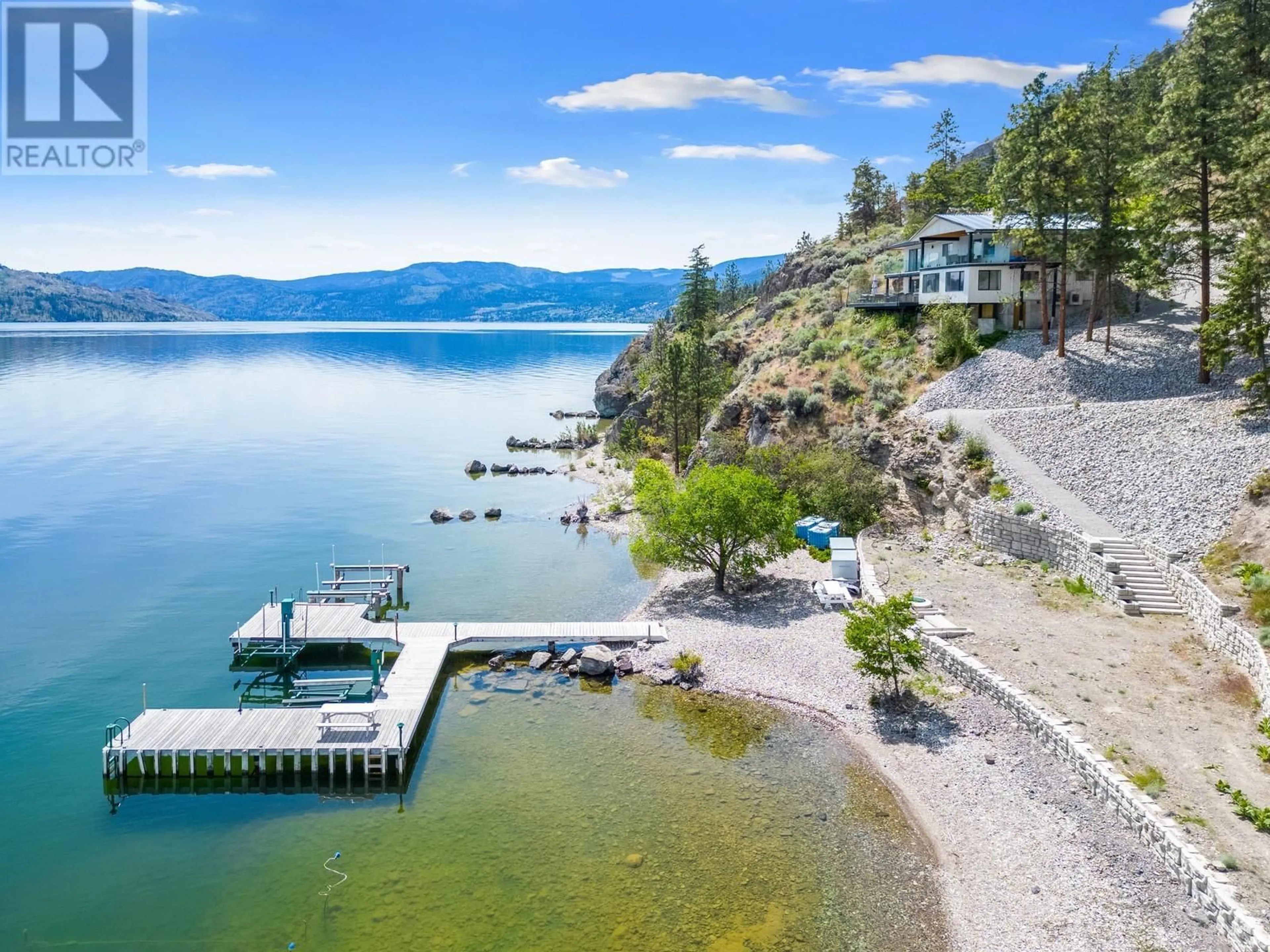 A pic from outside/outdoor area/front of a property/back of a property/a pic from drone, water/lake/river/ocean view for 2888 Seclusion Bay Road, West Kelowna British Columbia V4T1W5