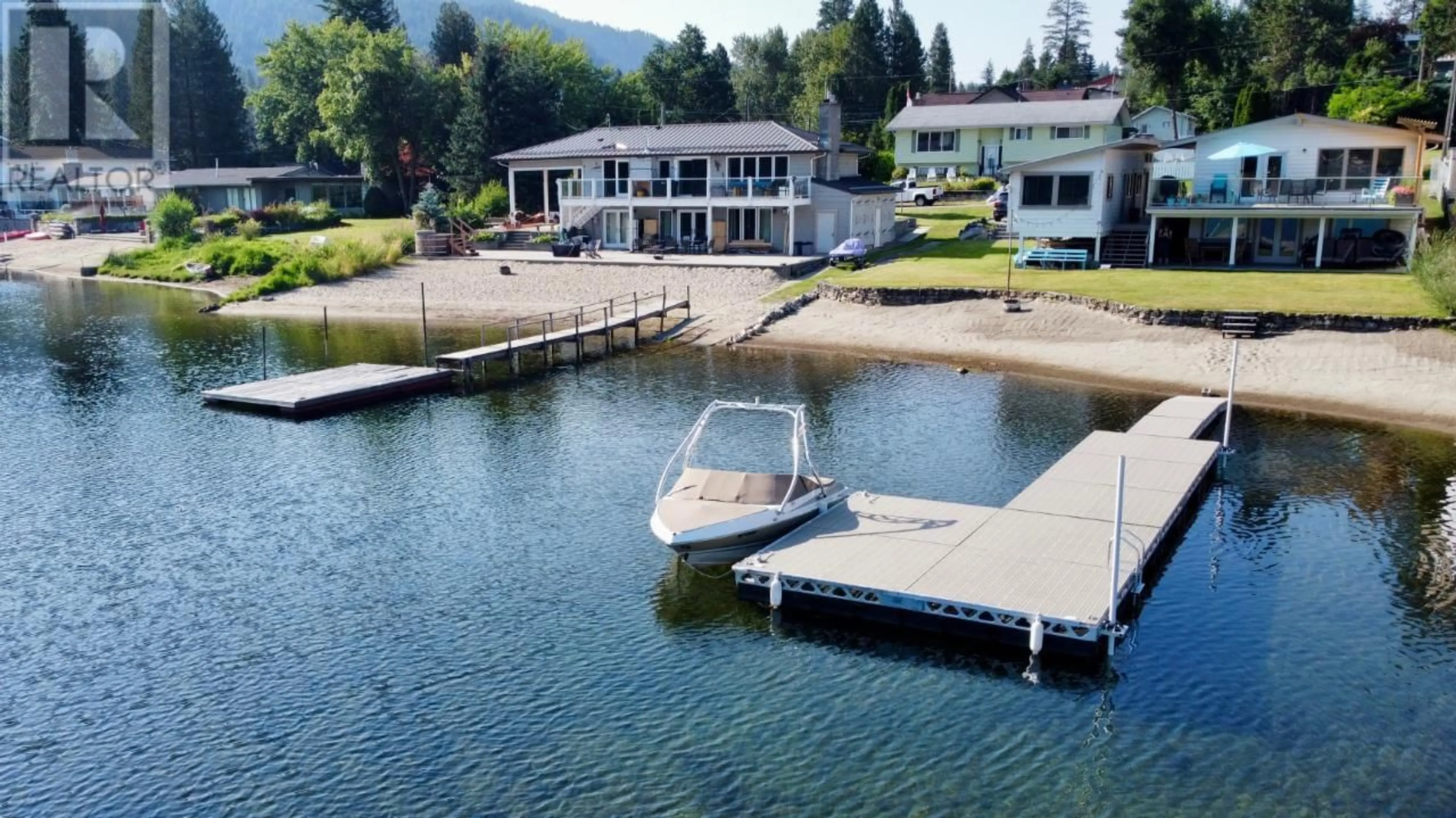 A pic from outside/outdoor area/front of a property/back of a property/a pic from drone, water/lake/river/ocean view for 52 SANDNER Road, Christina Lake British Columbia V0H1E0