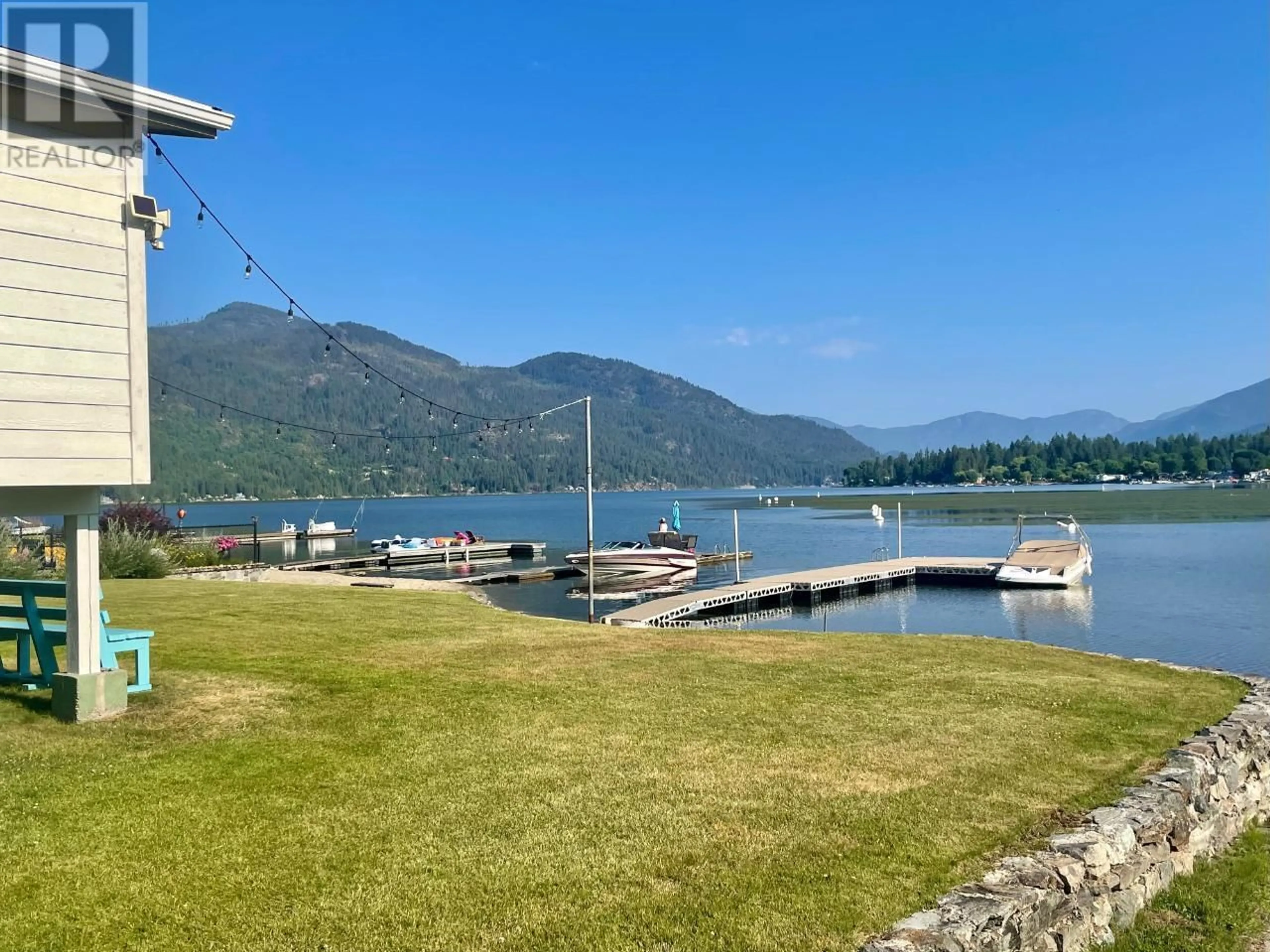 A pic from outside/outdoor area/front of a property/back of a property/a pic from drone, water/lake/river/ocean view for 52 SANDNER Road, Christina Lake British Columbia V0H1E0