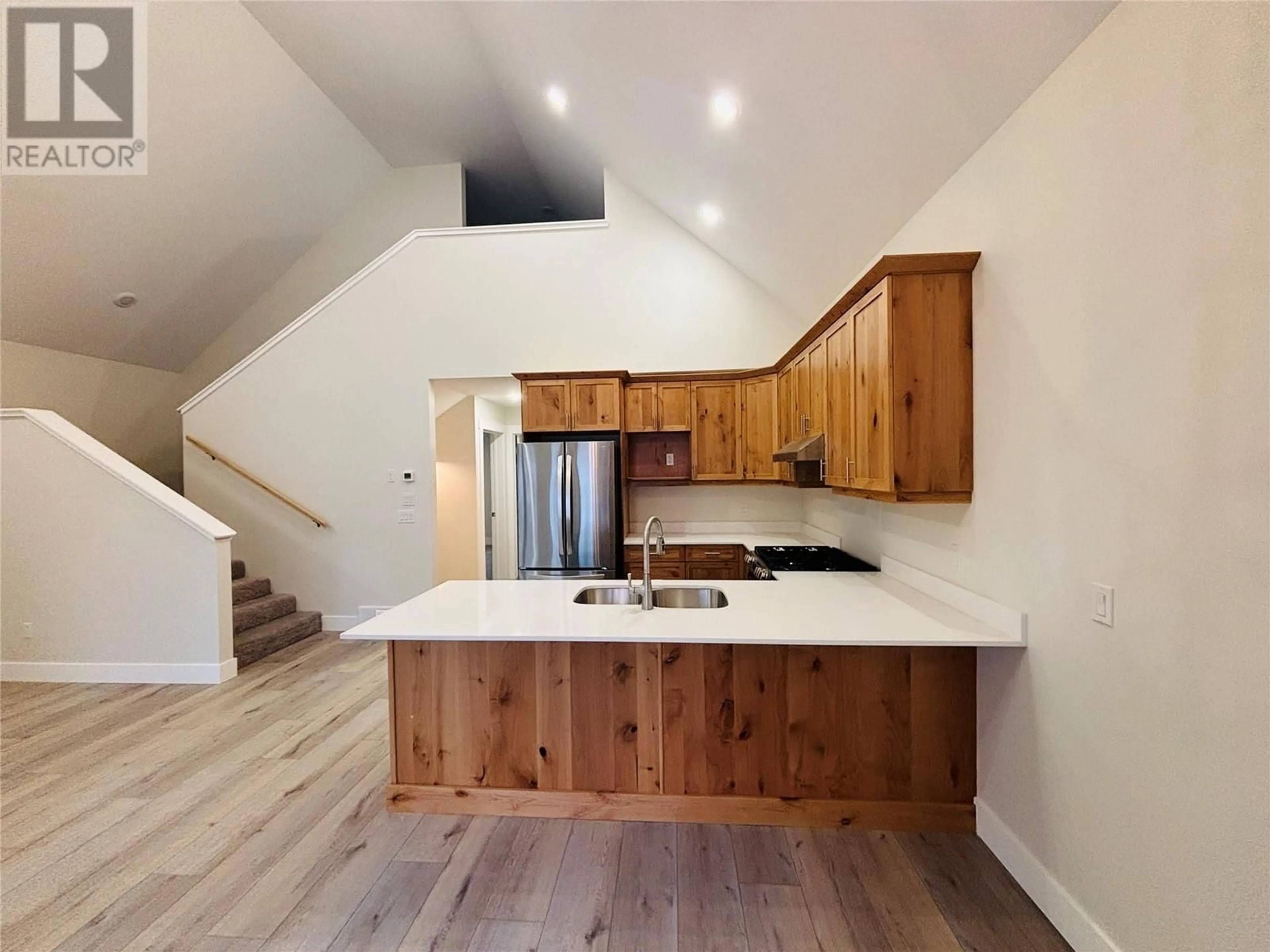 Open concept kitchen, wood/laminate floor for 1938 FOXWOOD Trail Unit# 4, Windermere British Columbia V0B2L2