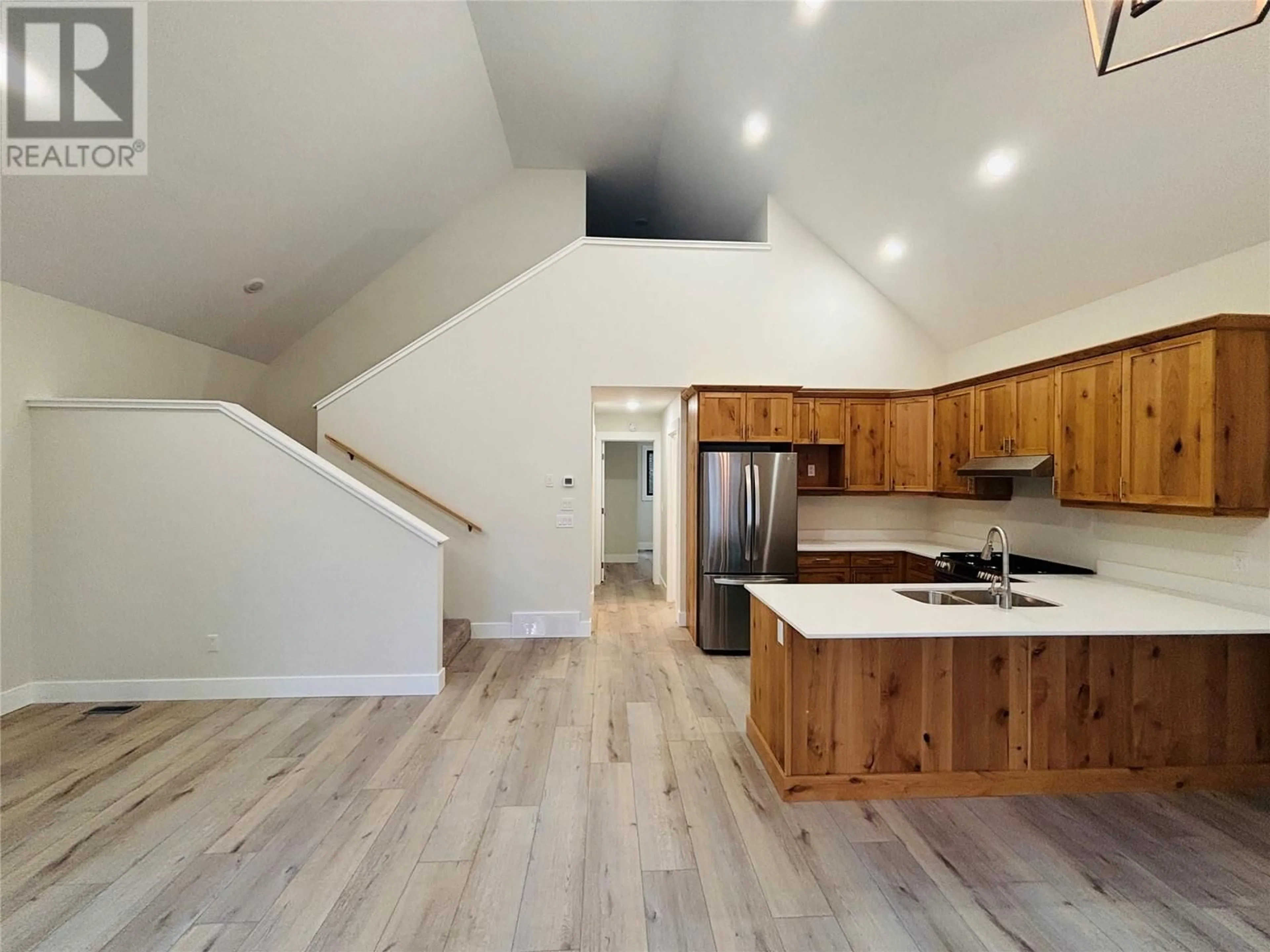 Open concept kitchen, wood/laminate floor for 1938 FOXWOOD Trail Unit# 2, Windermere British Columbia V0B2L2