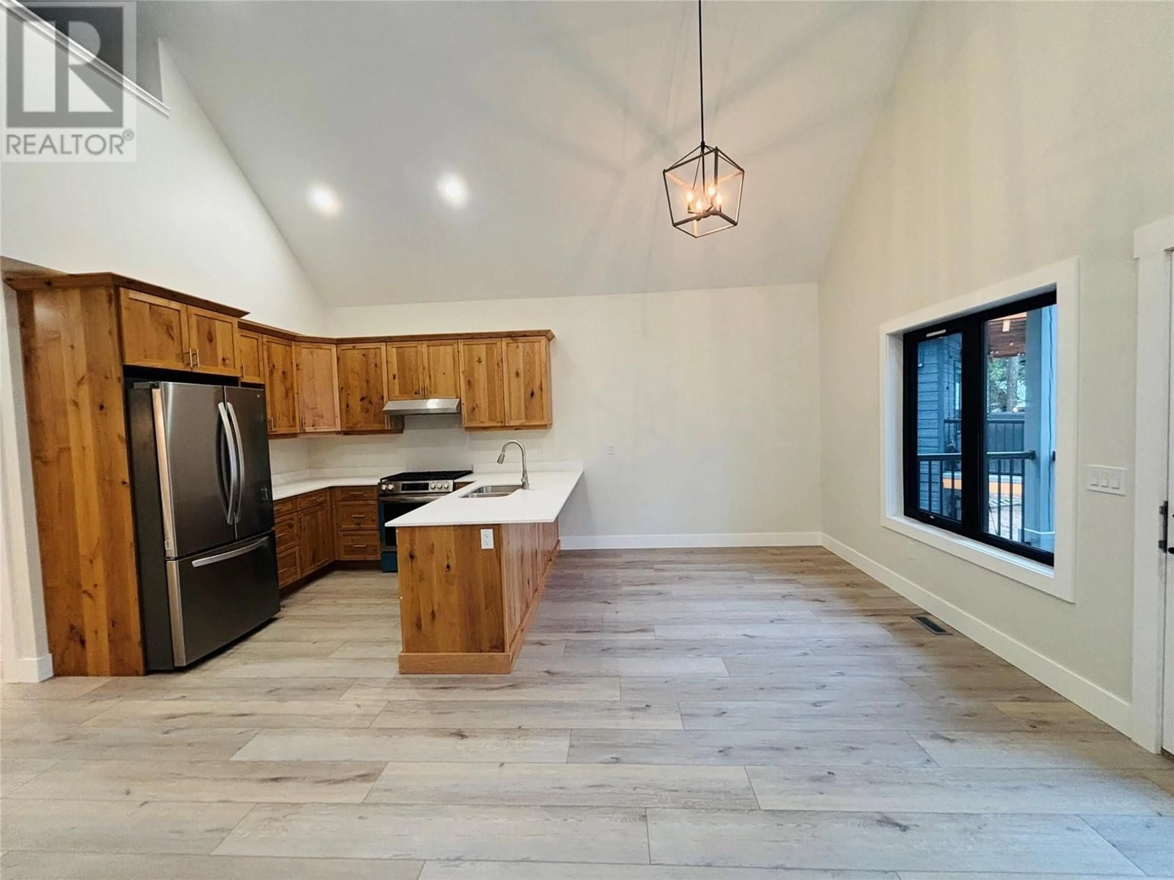 Open concept kitchen, wood/laminate floor for 1938 FOXWOOD Trail Unit# 2, Windermere British Columbia V0B2L2