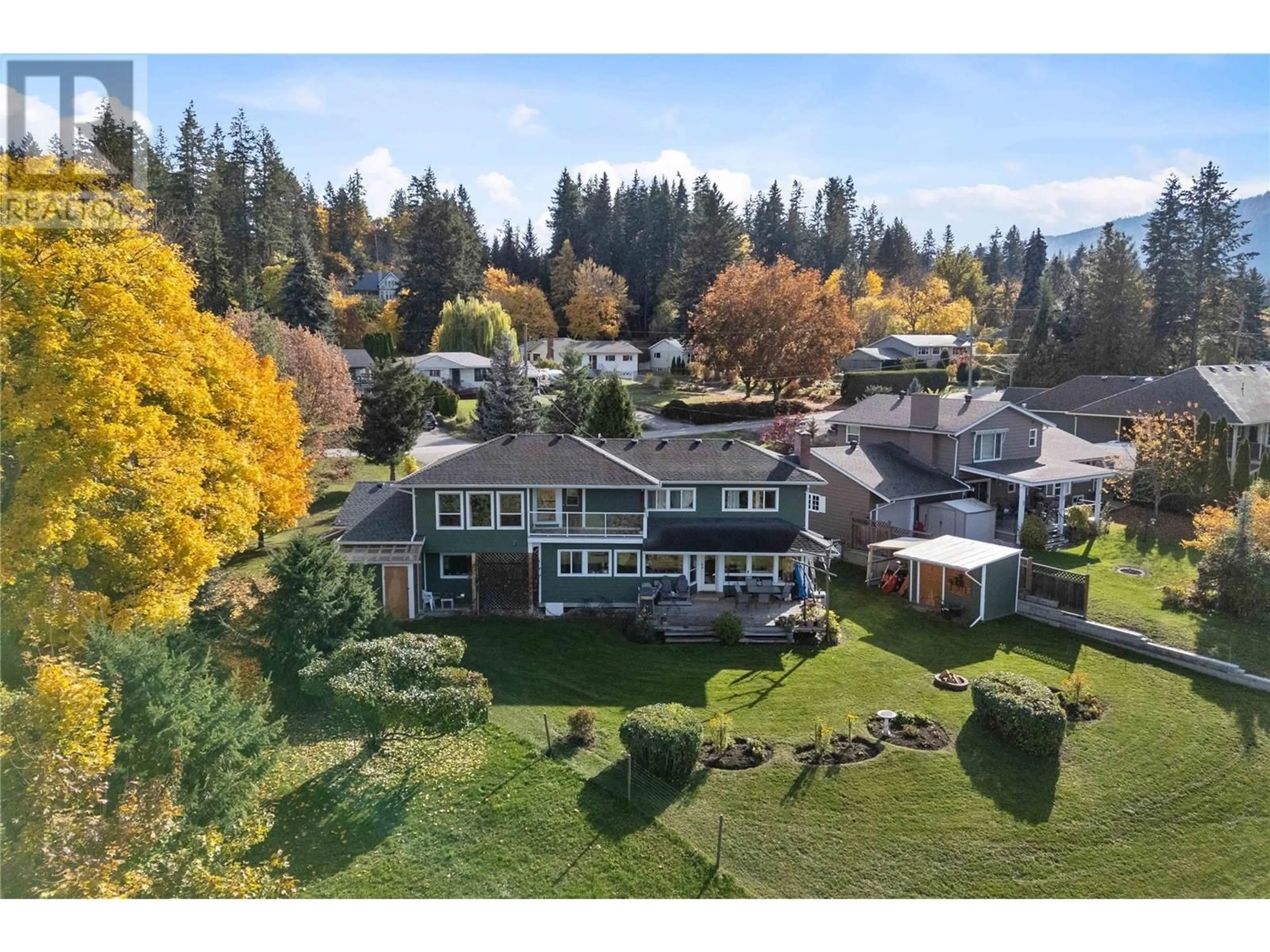 A pic from outside/outdoor area/front of a property/back of a property/a pic from drone, mountain view for 1461 16 Street NE, Salmon Arm British Columbia V1E2T8