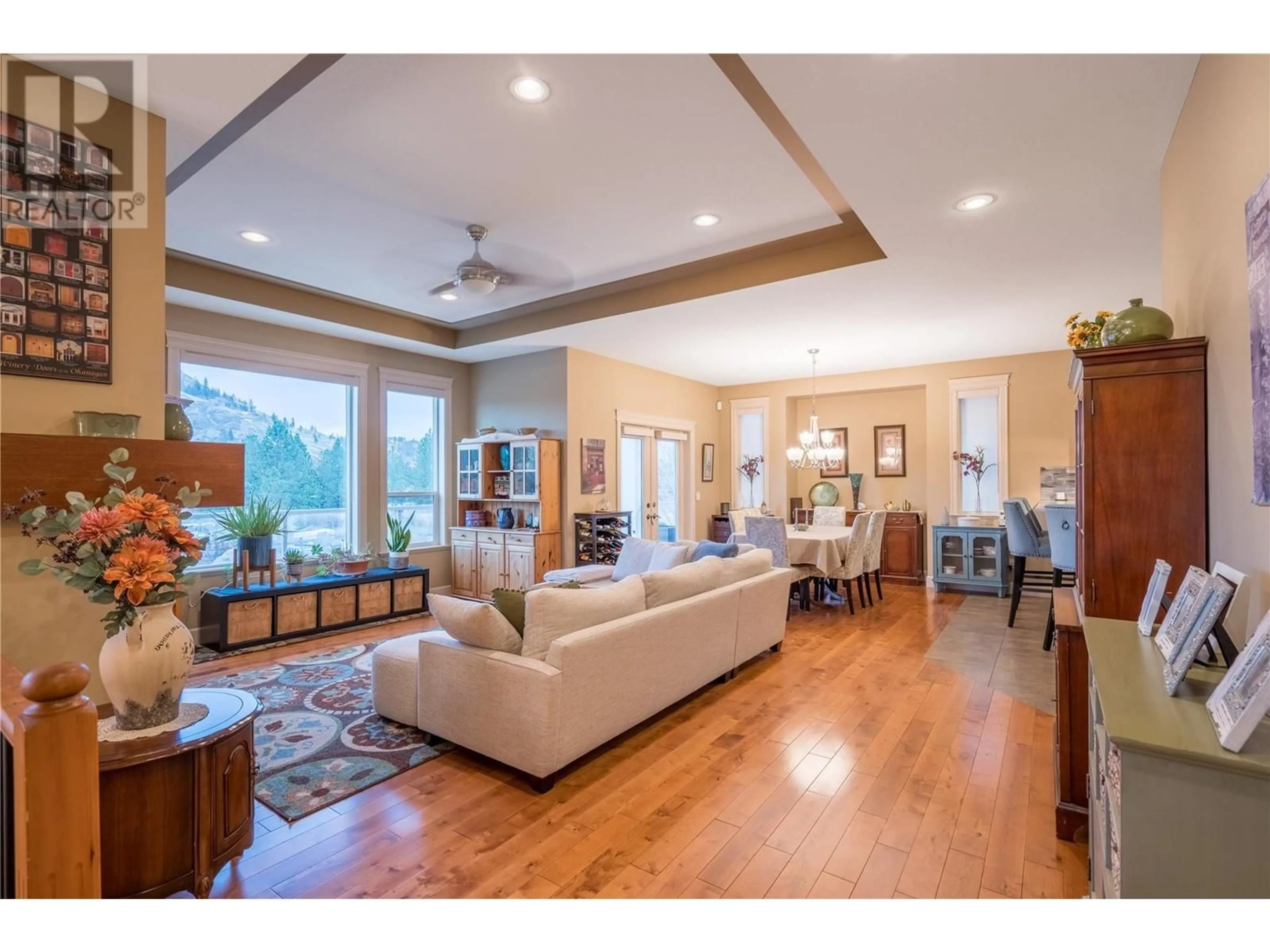 Living room with furniture, wood/laminate floor for 2836 Auburn Road, West Kelowna British Columbia V4T3B2