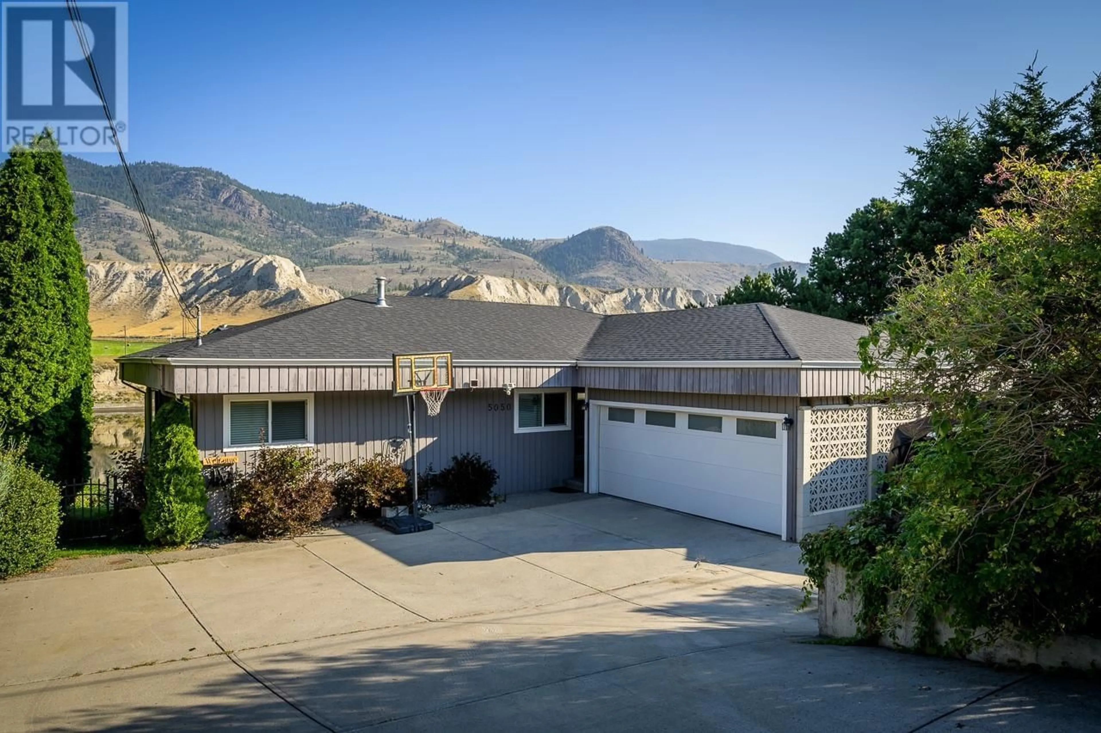 A pic from outside/outdoor area/front of a property/back of a property/a pic from drone, mountain view for 5050 KIPP Road, Kamloops British Columbia V2H1T7