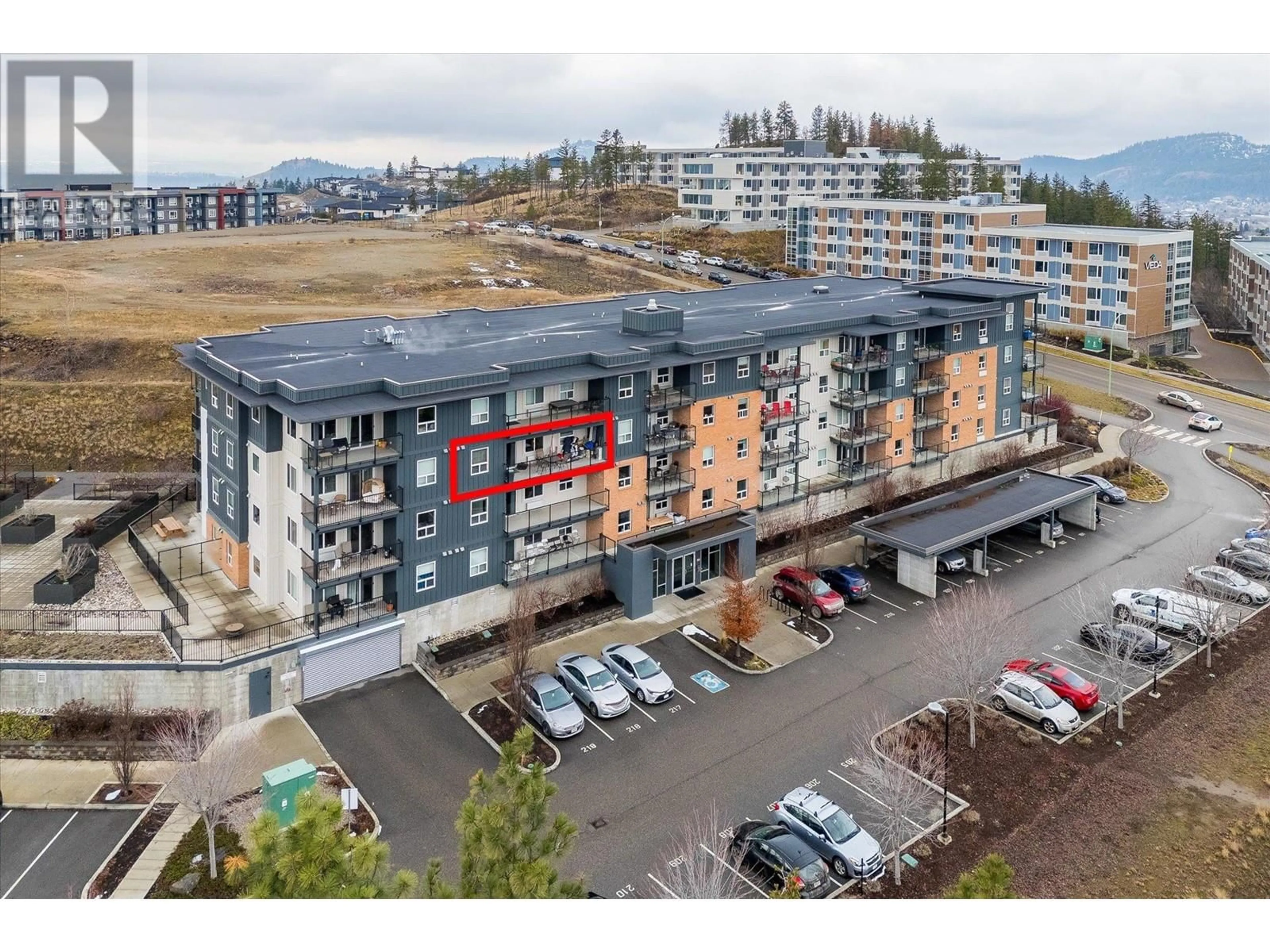 A pic from outside/outdoor area/front of a property/back of a property/a pic from drone, unknown for 881 Academy Way Unit# 316, Kelowna British Columbia V1V0A3