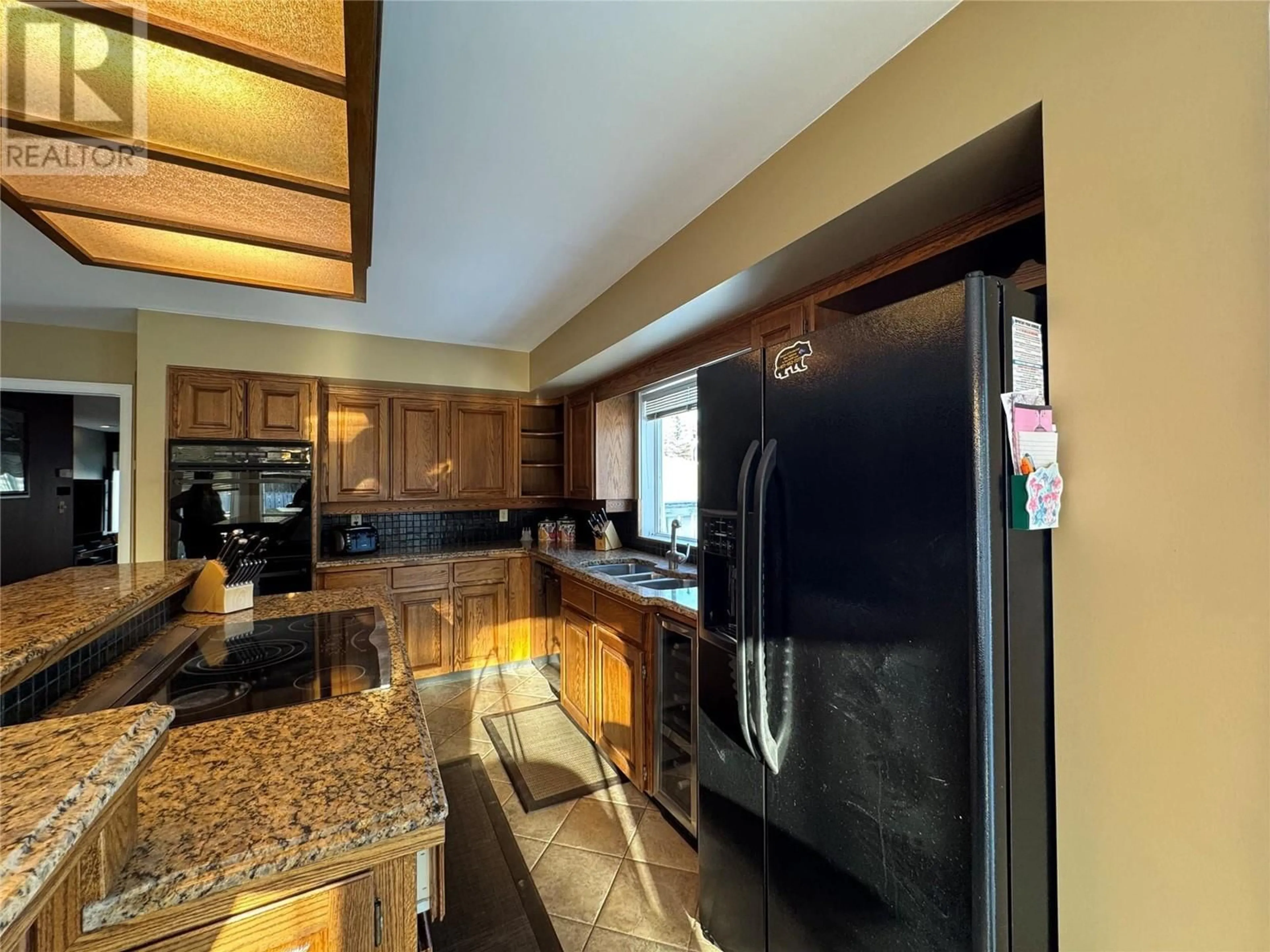 Open concept kitchen, ceramic/tile floor for 12 Collier Place, Tumbler Ridge British Columbia V0C2W0