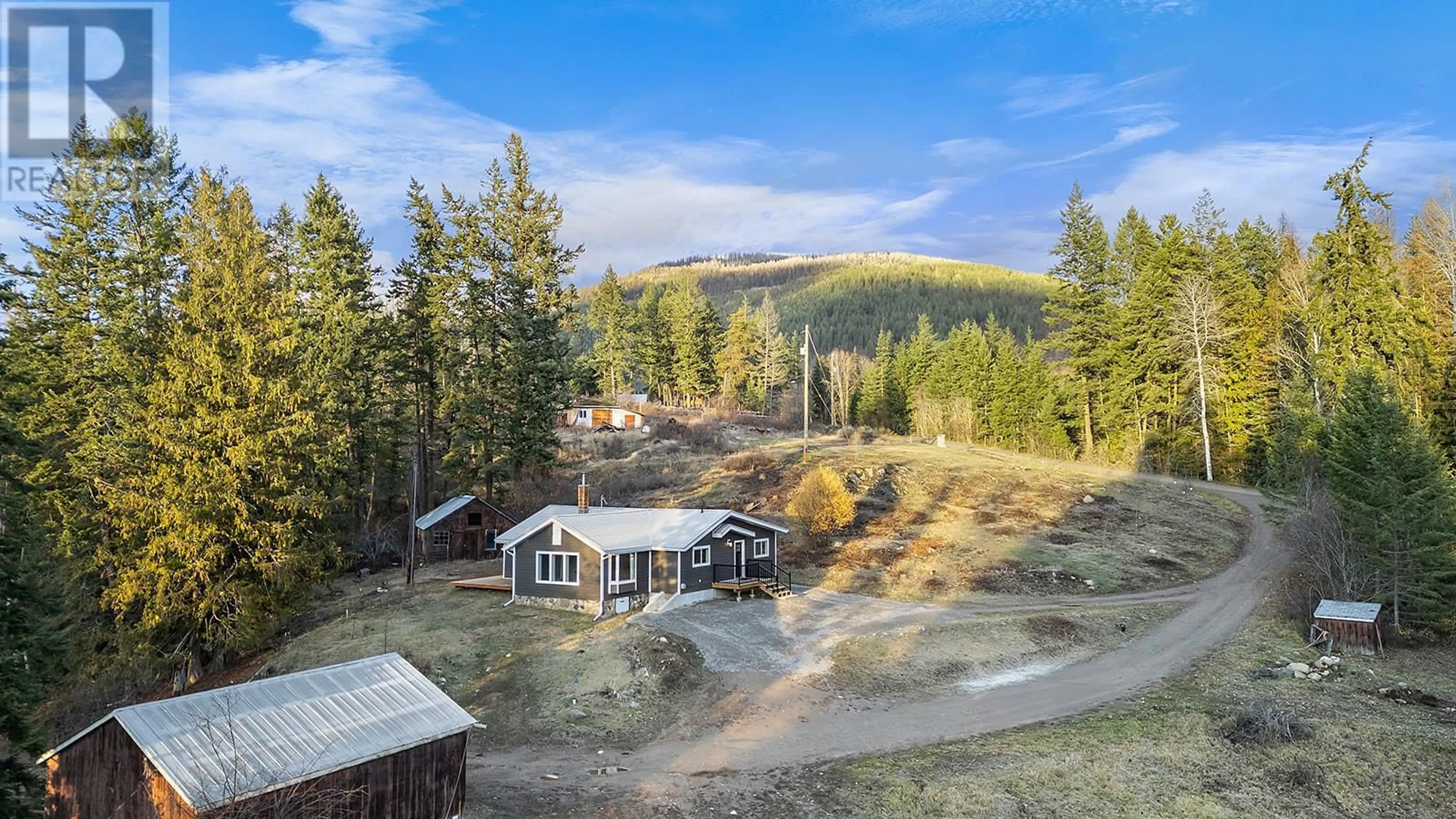 A pic from outside/outdoor area/front of a property/back of a property/a pic from drone, mountain view for 3685 Foster Road, Creston British Columbia V0B1G8