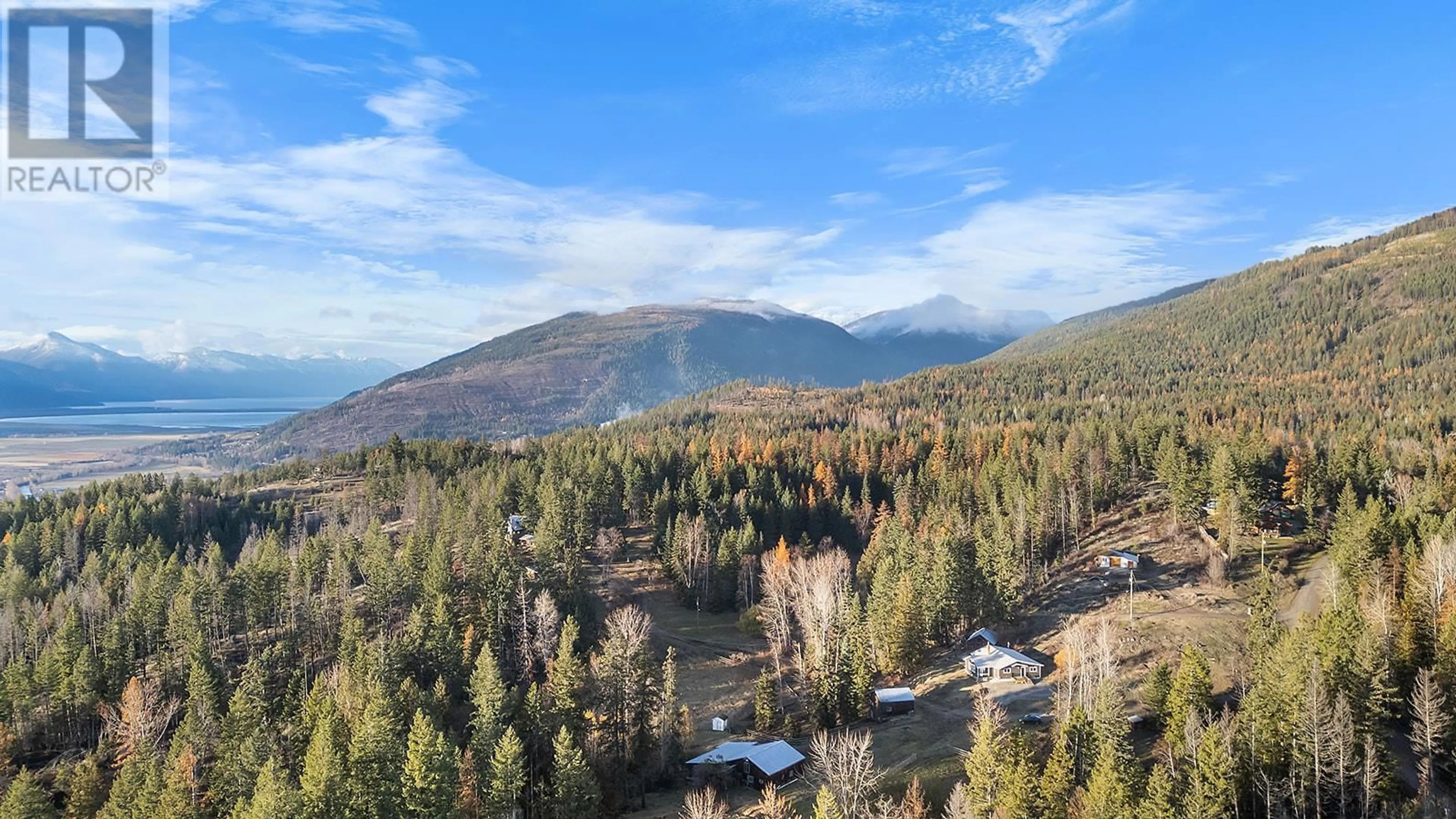 A pic from outside/outdoor area/front of a property/back of a property/a pic from drone, forest/trees view for 3685 Foster Road, Creston British Columbia V0B1G8