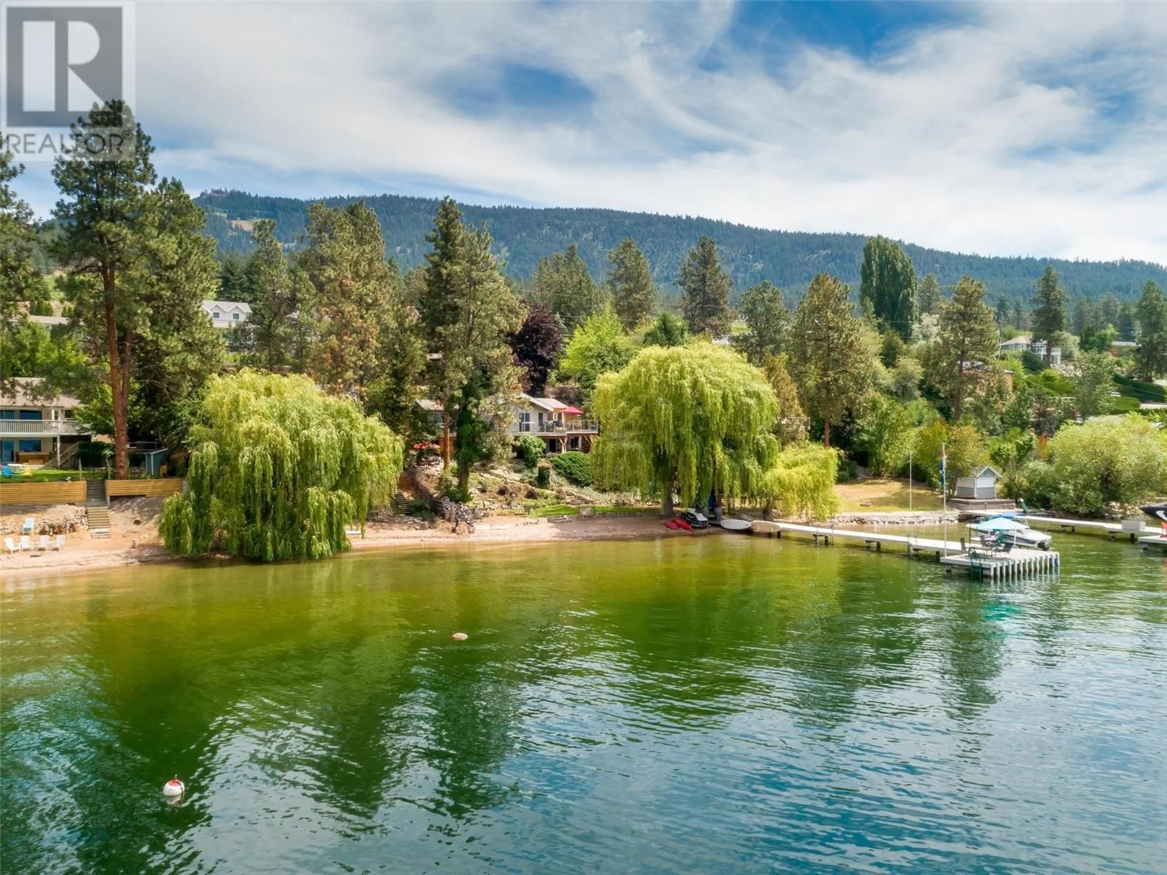 A pic from outside/outdoor area/front of a property/back of a property/a pic from drone, water/lake/river/ocean view for 17130 Coral Beach Road, Lake Country British Columbia V4V1B9