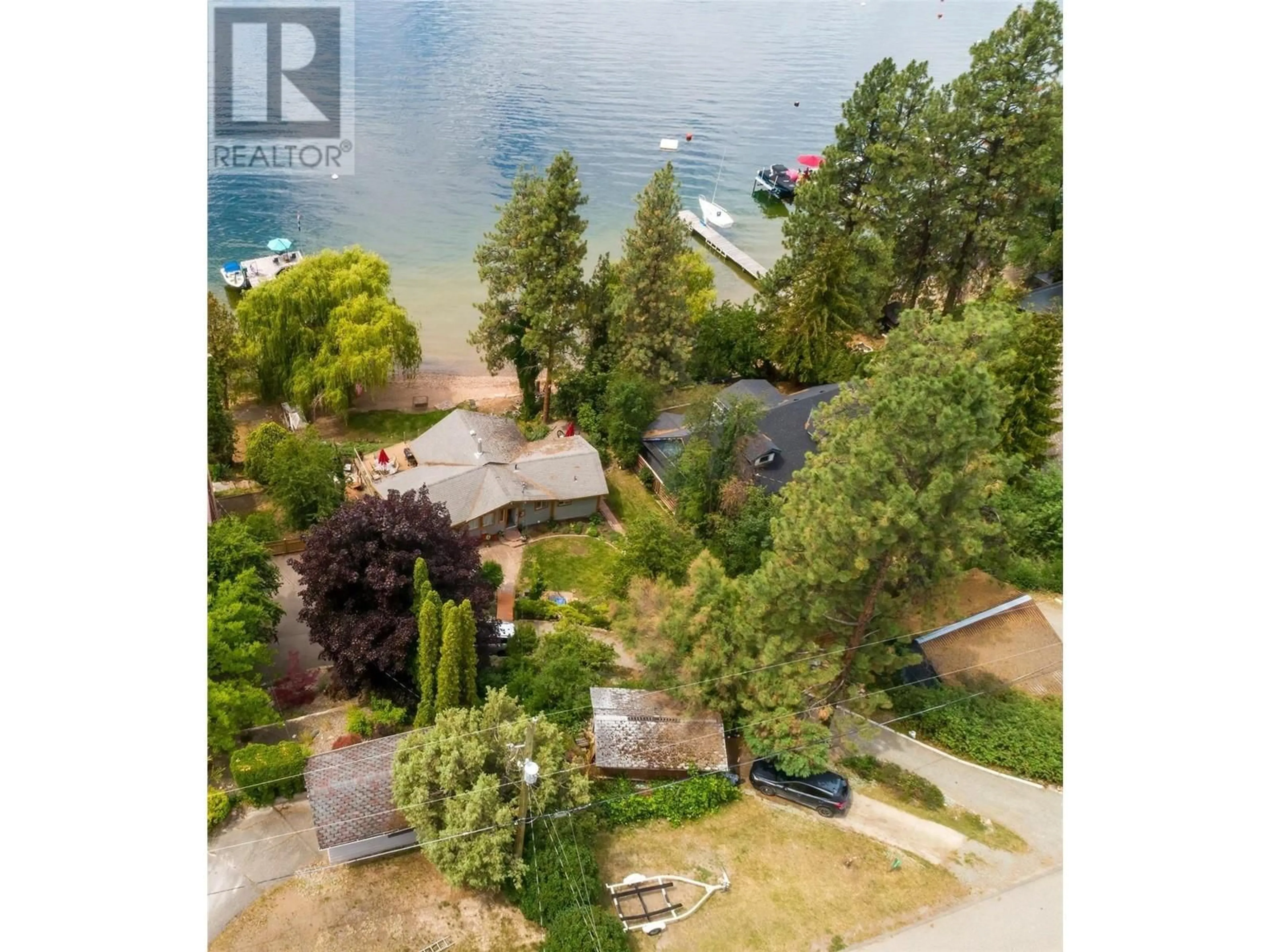 A pic from outside/outdoor area/front of a property/back of a property/a pic from drone, water/lake/river/ocean view for 17130 Coral Beach Road, Lake Country British Columbia V4V1B9