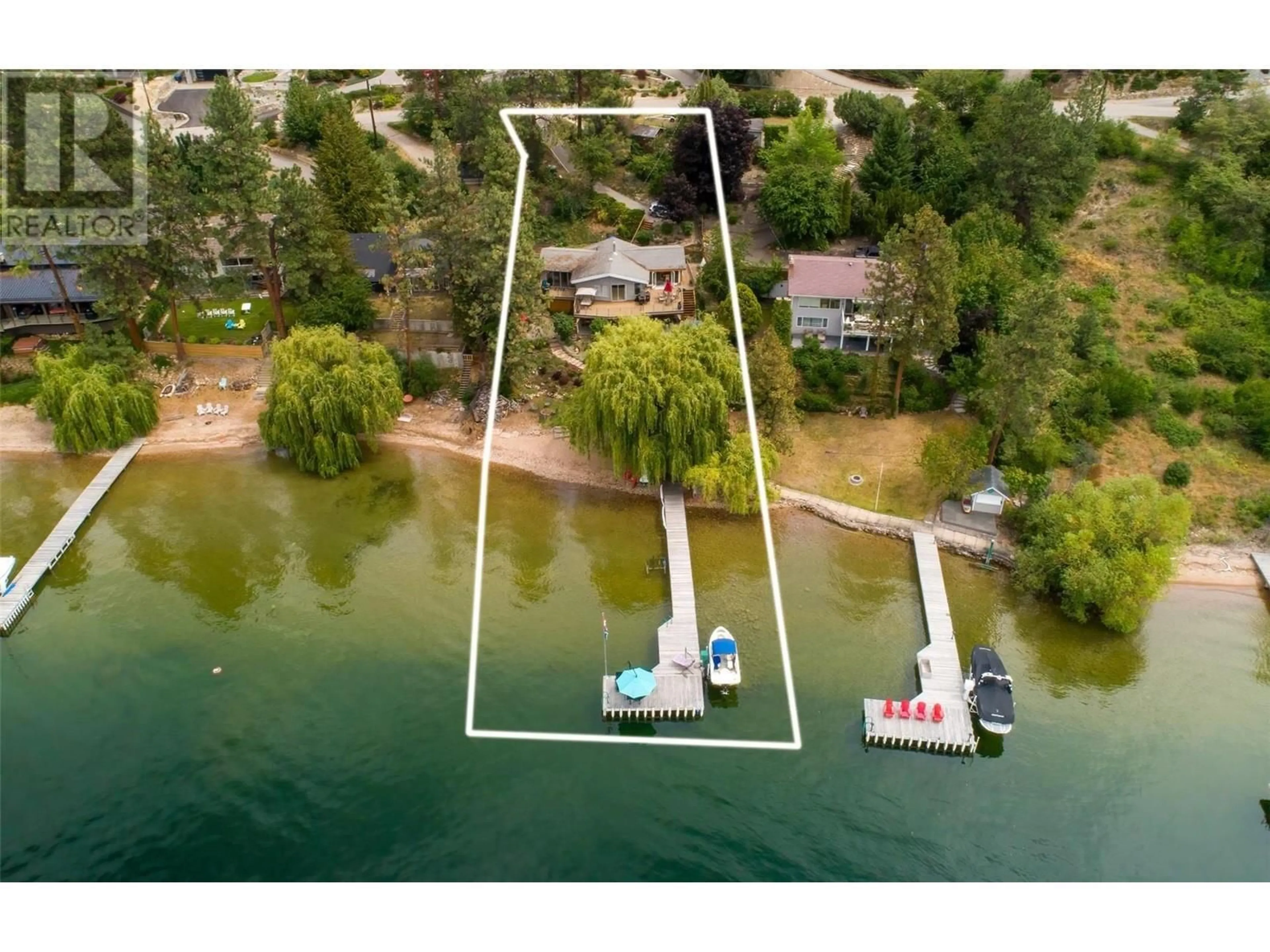 A pic from outside/outdoor area/front of a property/back of a property/a pic from drone, water/lake/river/ocean view for 17130 Coral Beach Road, Lake Country British Columbia V4V1B9