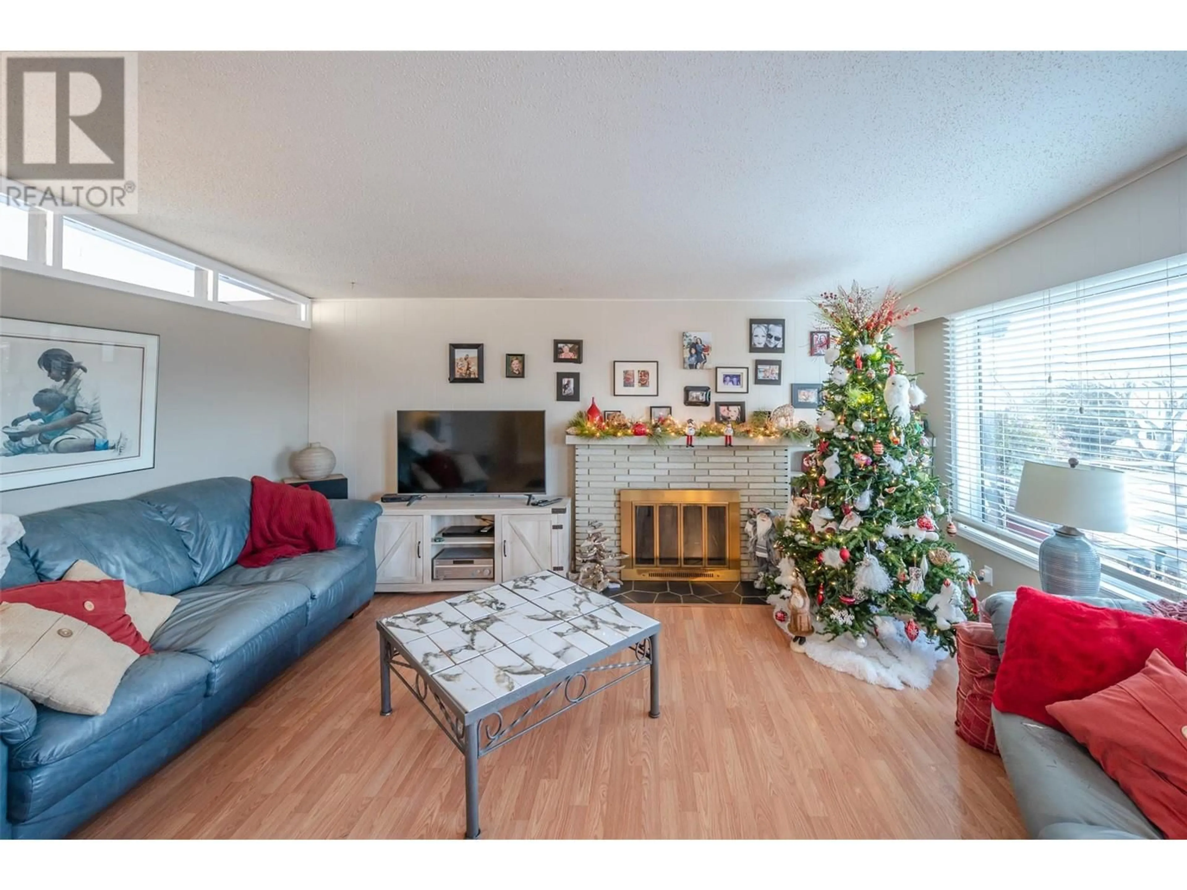 Living room with furniture, wood/laminate floor for 1467 CARMI Drive, Penticton British Columbia V2A4R9