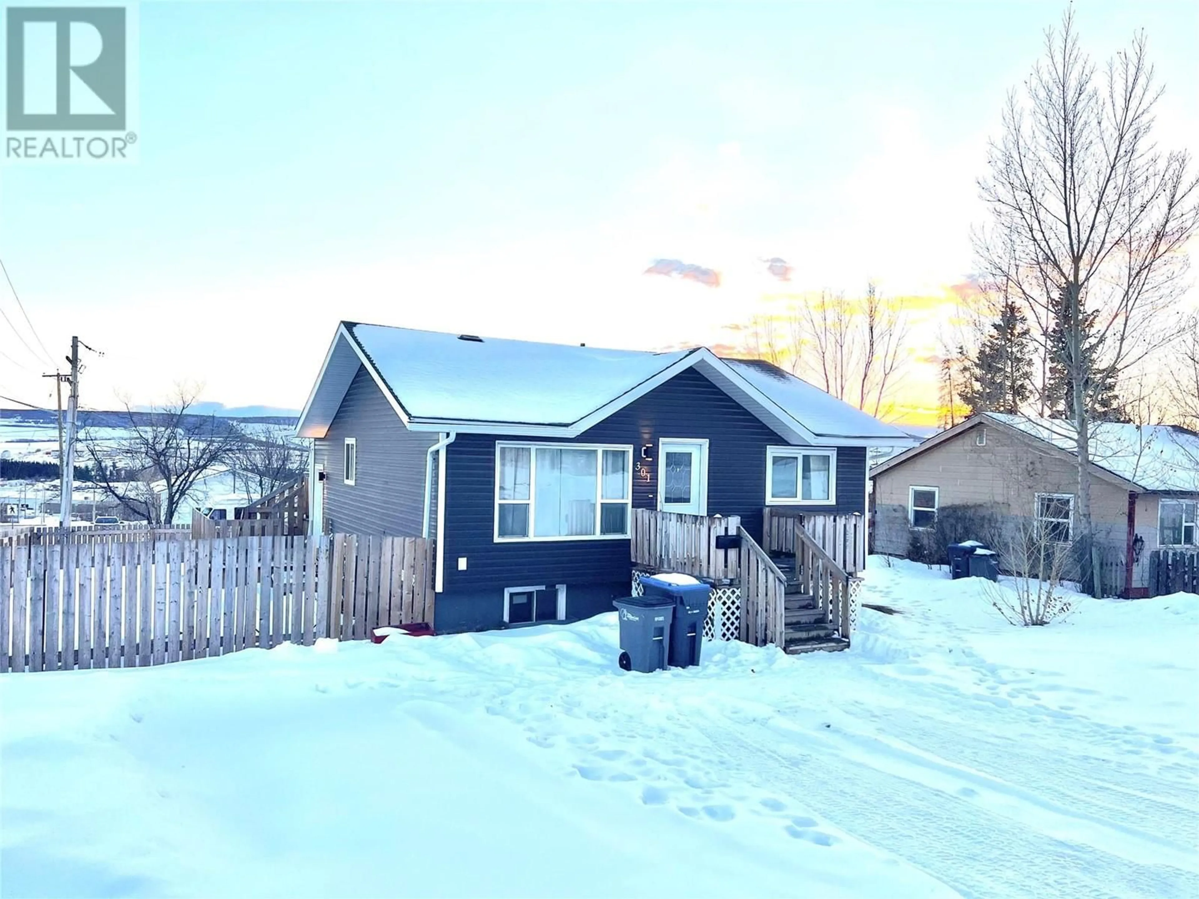 A pic from outside/outdoor area/front of a property/back of a property/a pic from drone, street for 301 100A Avenue, Dawson Creek British Columbia V1G1X5