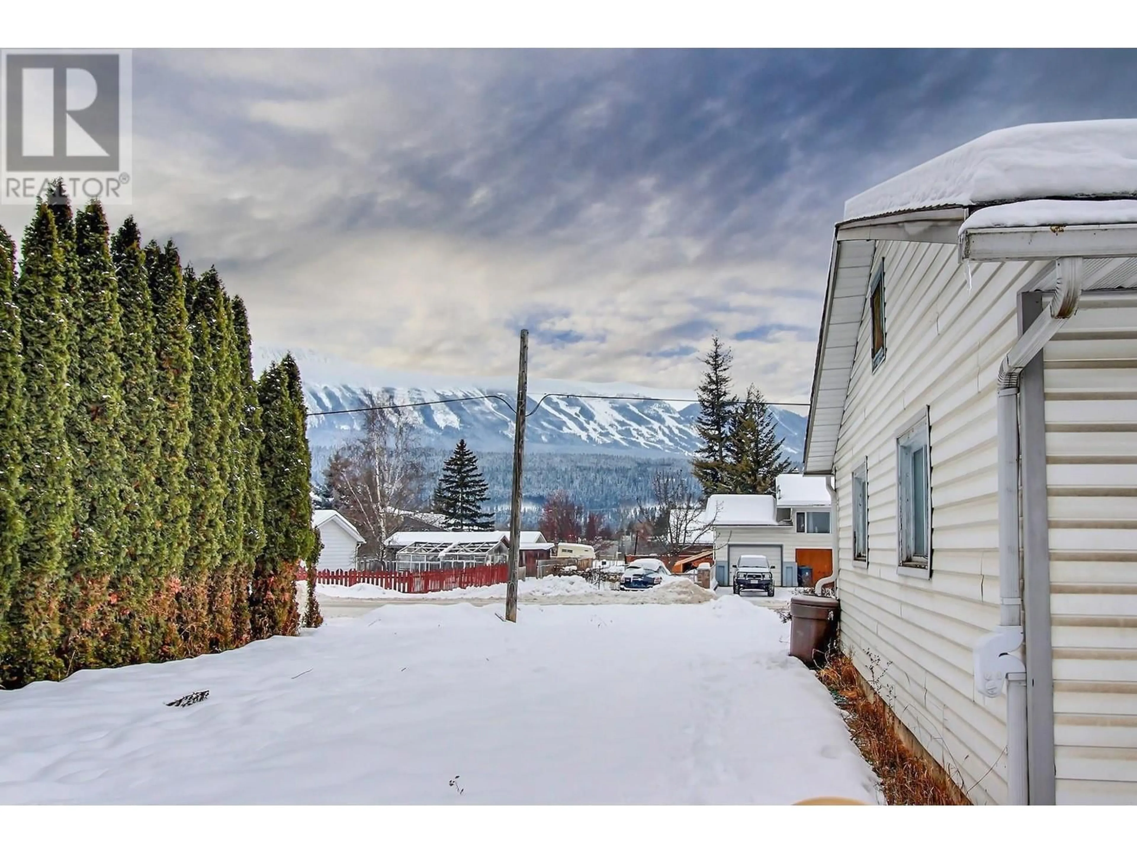 A pic from outside/outdoor area/front of a property/back of a property/a pic from drone, mountain view for 1202 10 Street S, Golden British Columbia V0A1H0