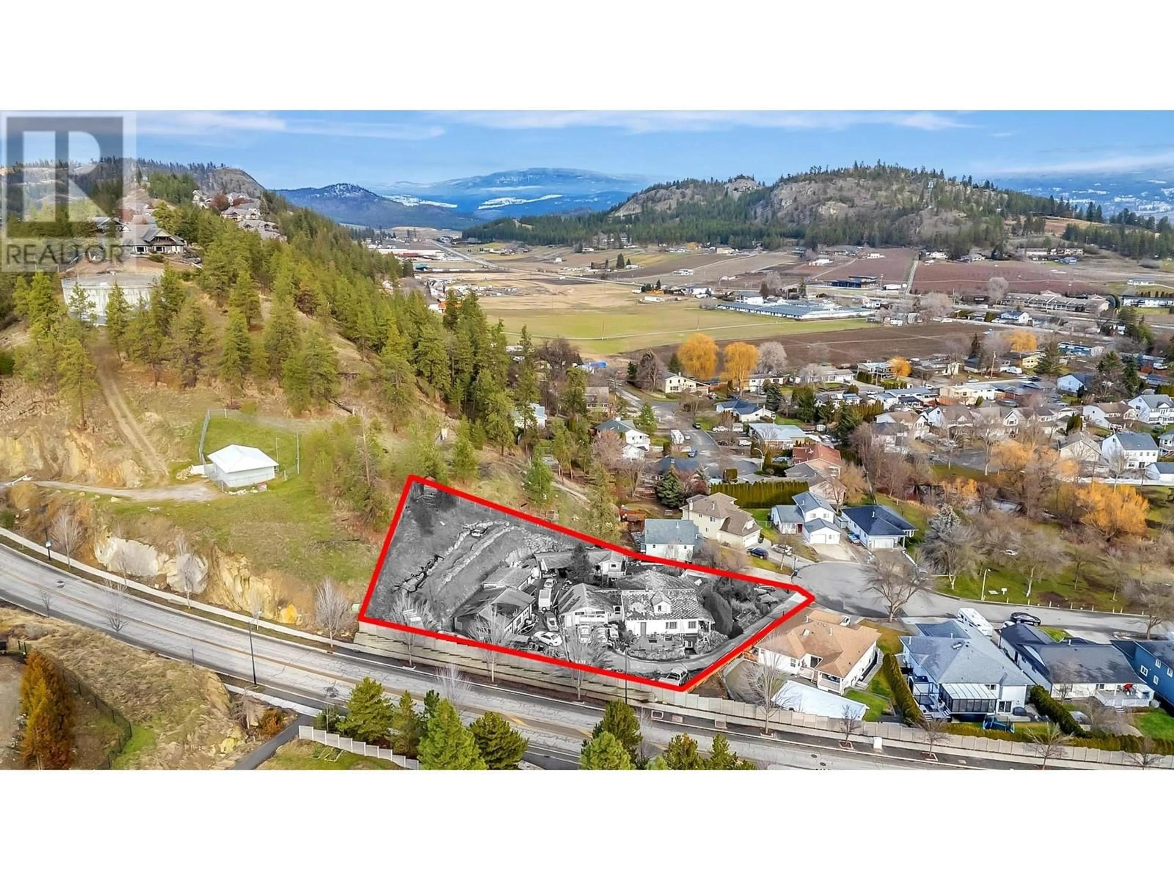 A pic from outside/outdoor area/front of a property/back of a property/a pic from drone, mountain view for 1819 MILLARD COURT, Kelowna British Columbia V1V1W1