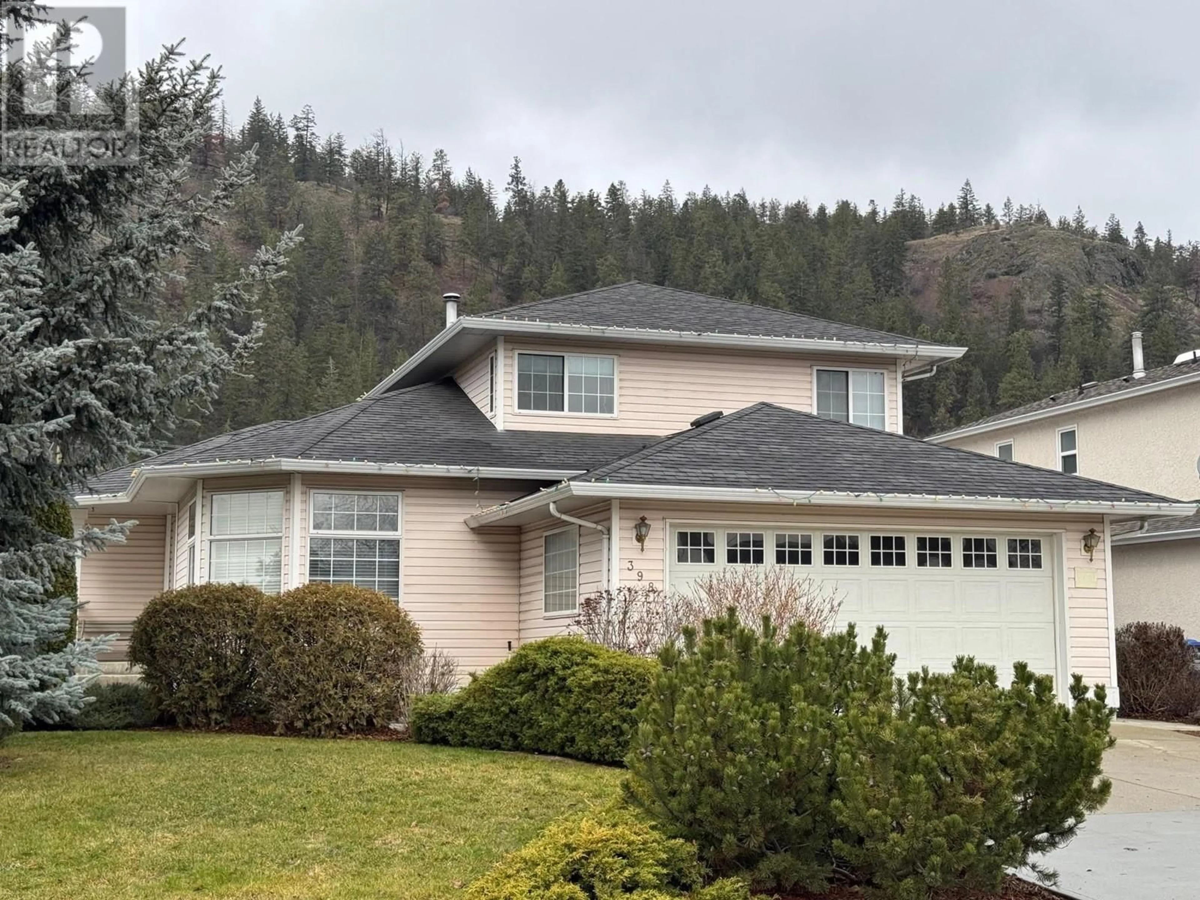 Home with vinyl exterior material, mountain view for 398 McTavish Road, Kelowna British Columbia V1V1P1