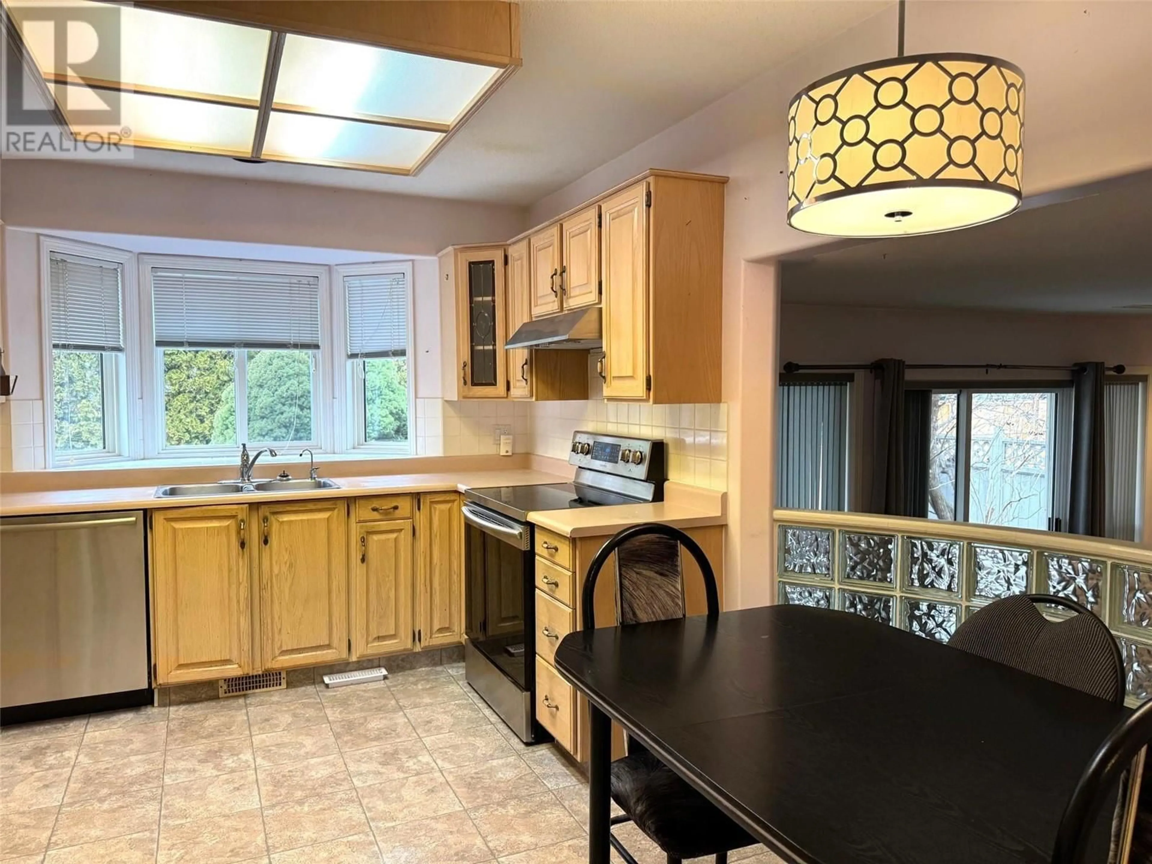 Open concept kitchen, ceramic/tile floor for 398 McTavish Road, Kelowna British Columbia V1V1P1