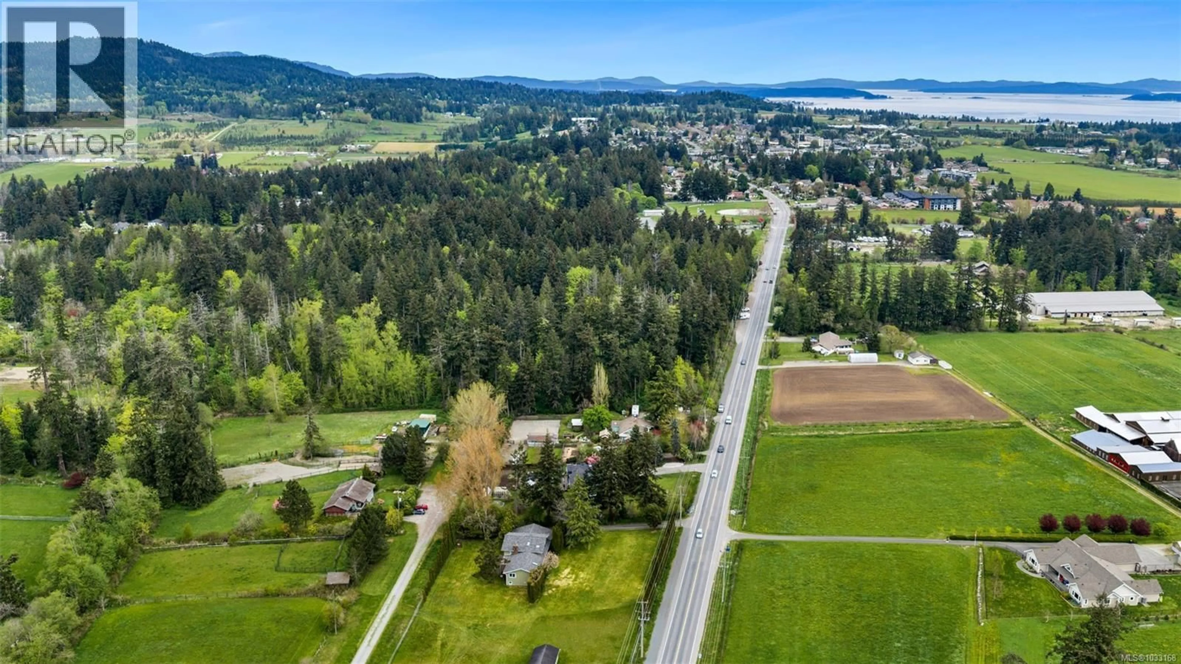 A pic from outside/outdoor area/front of a property/back of a property/a pic from drone, mountain view for 7356 WALLACE DRIVE, Central Saanich British Columbia V8M1S9