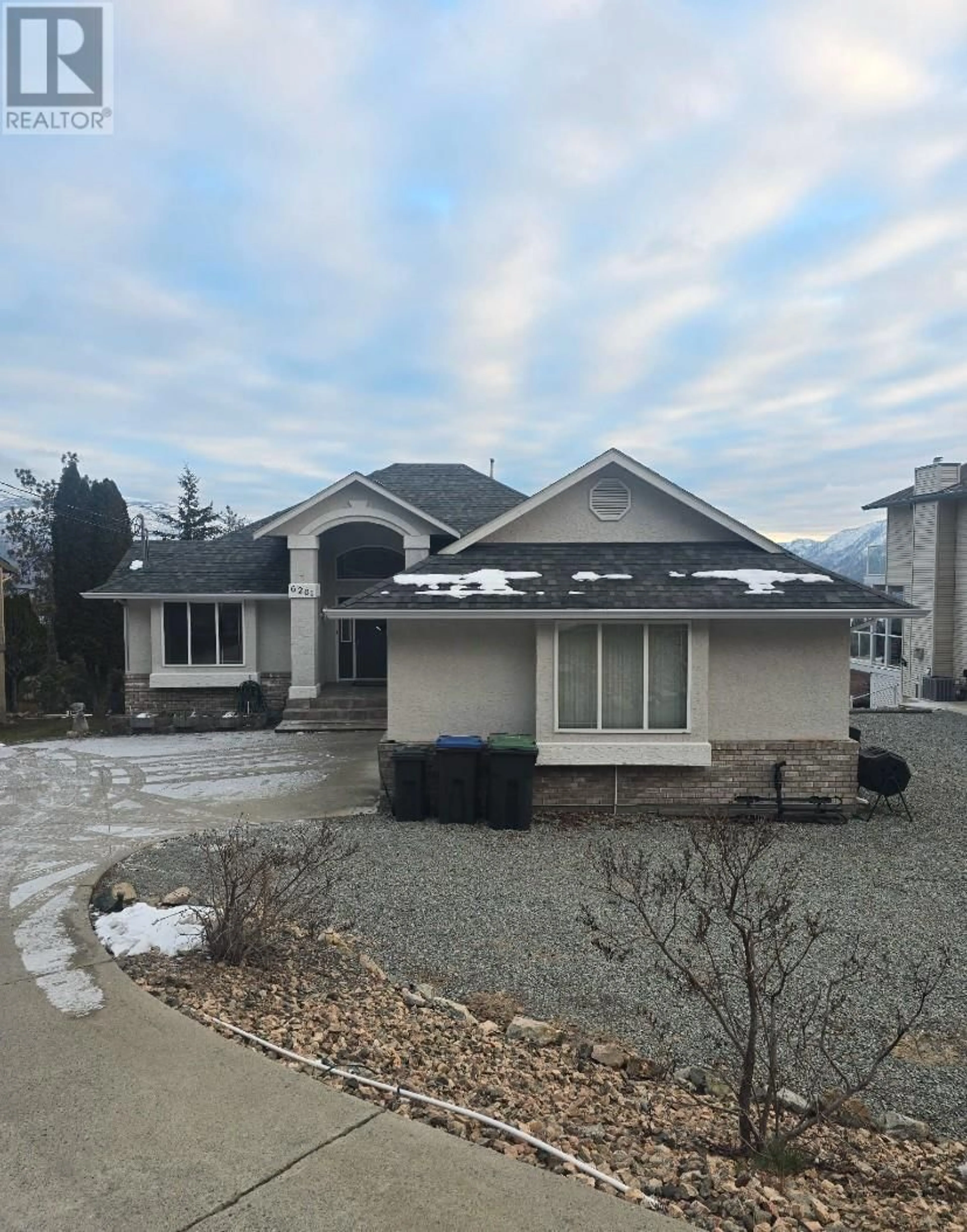 Home with vinyl exterior material, street for 6261 THOMPSON DRIVE, Peachland British Columbia V0H1X8